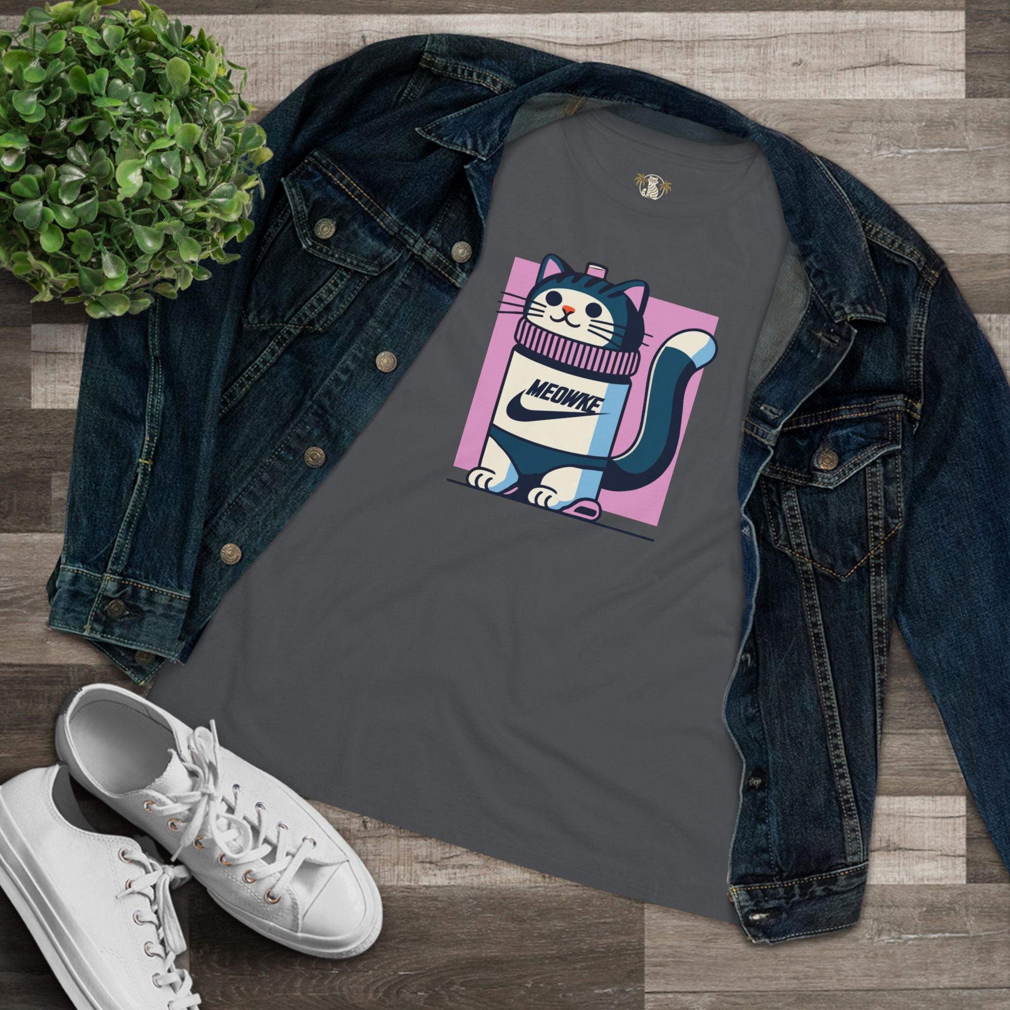 Flat lay asphalt gray women’s cat bottle graphic tee styled with denim jacket