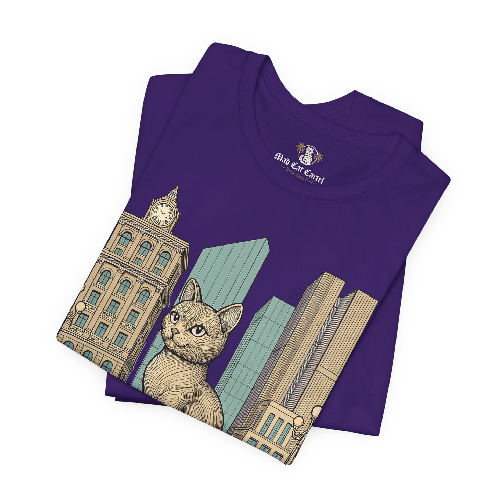 Tee shirts with cats – team purple unisex tee folded, Meowschino city cat statue print