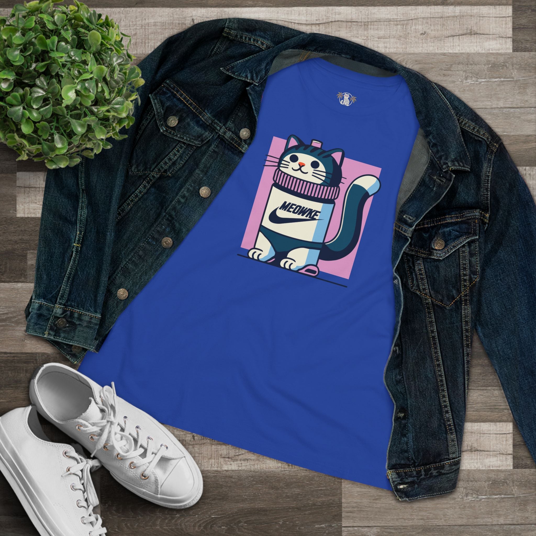 Flat lay blue women’s cat graphic t shirt styled with denim jacket