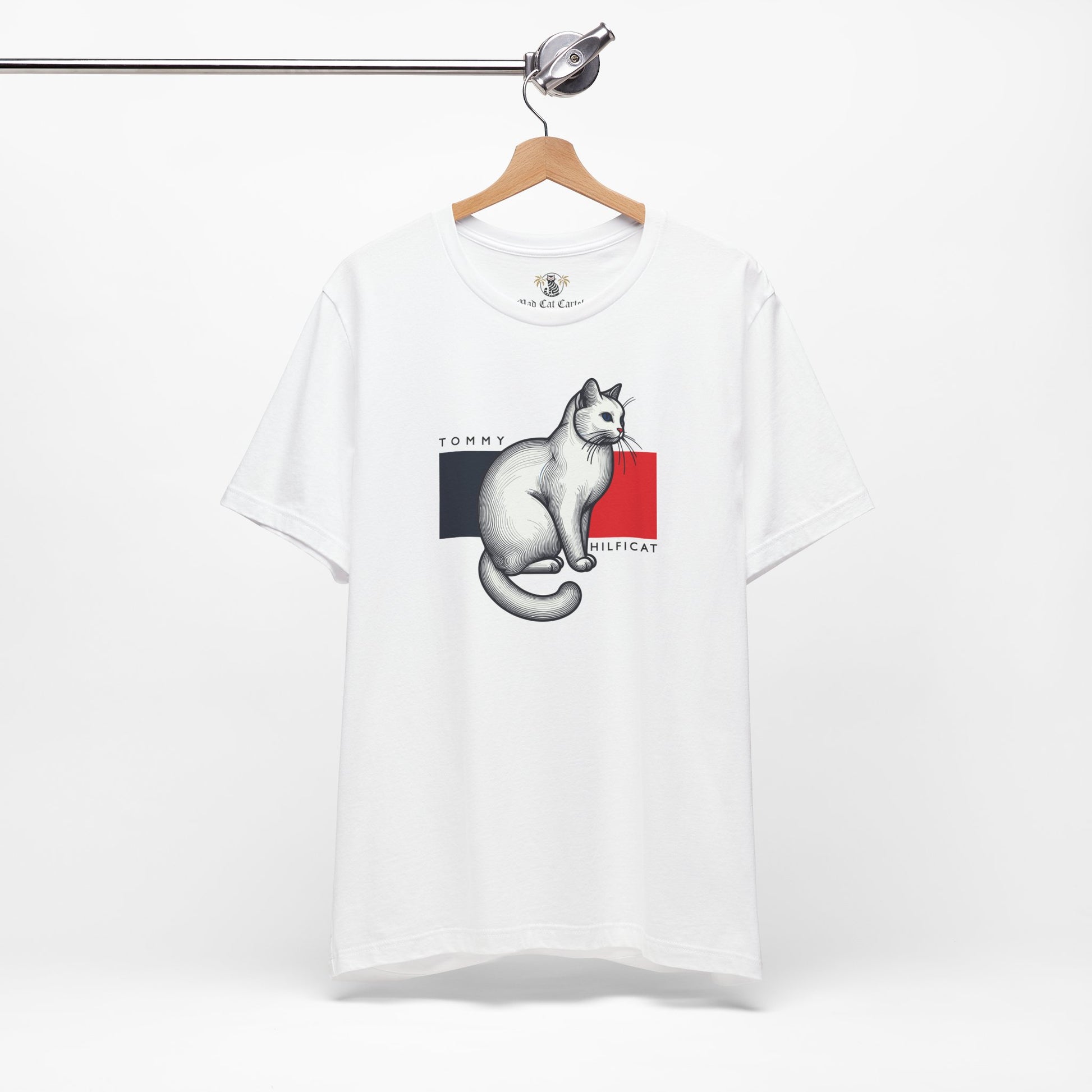White cat on a shirt front on hanger
