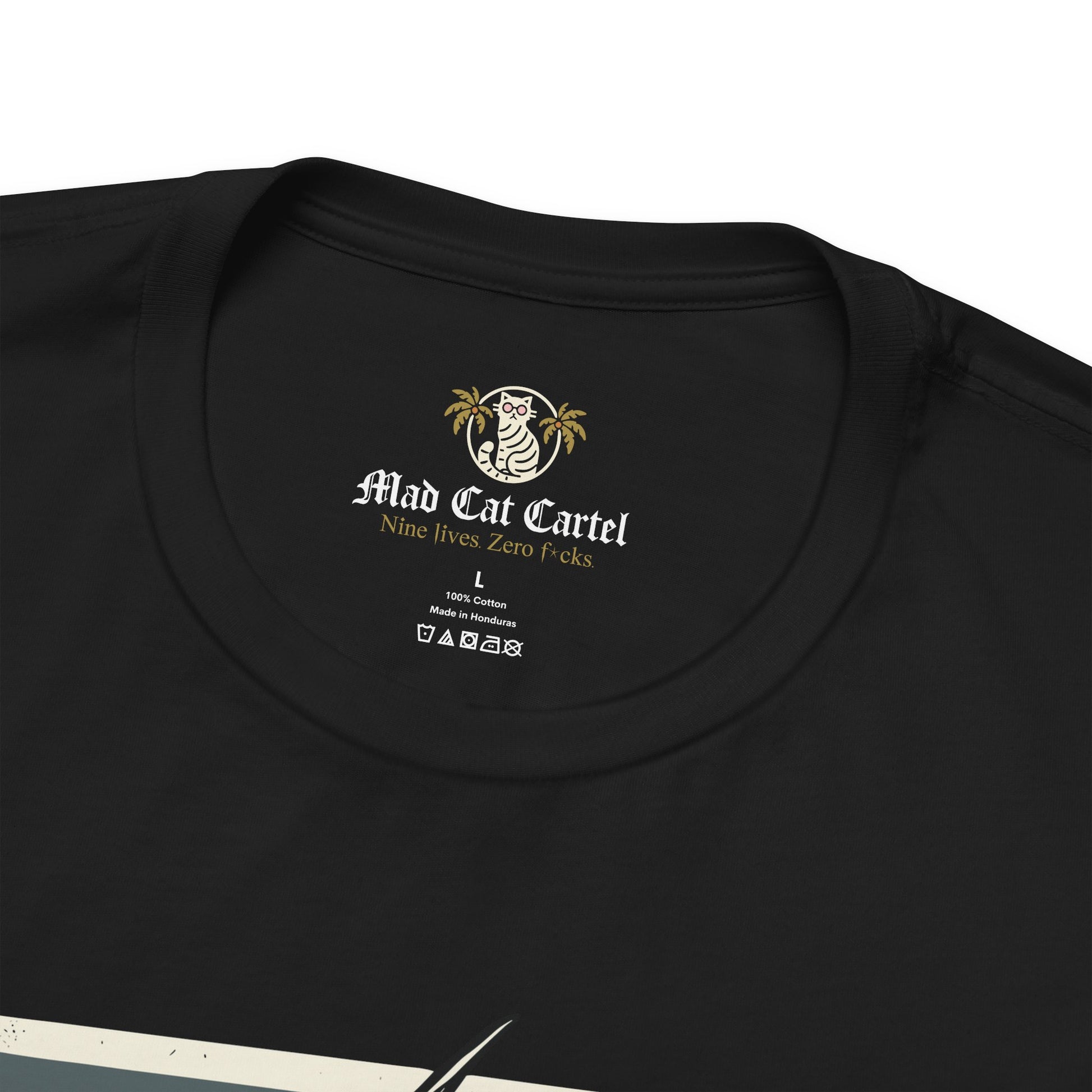 Close-up of black Purrada Exclusive Milano Cat Graphic T Shirt collar with Mad Cat Cartel label, shirts with cats on them