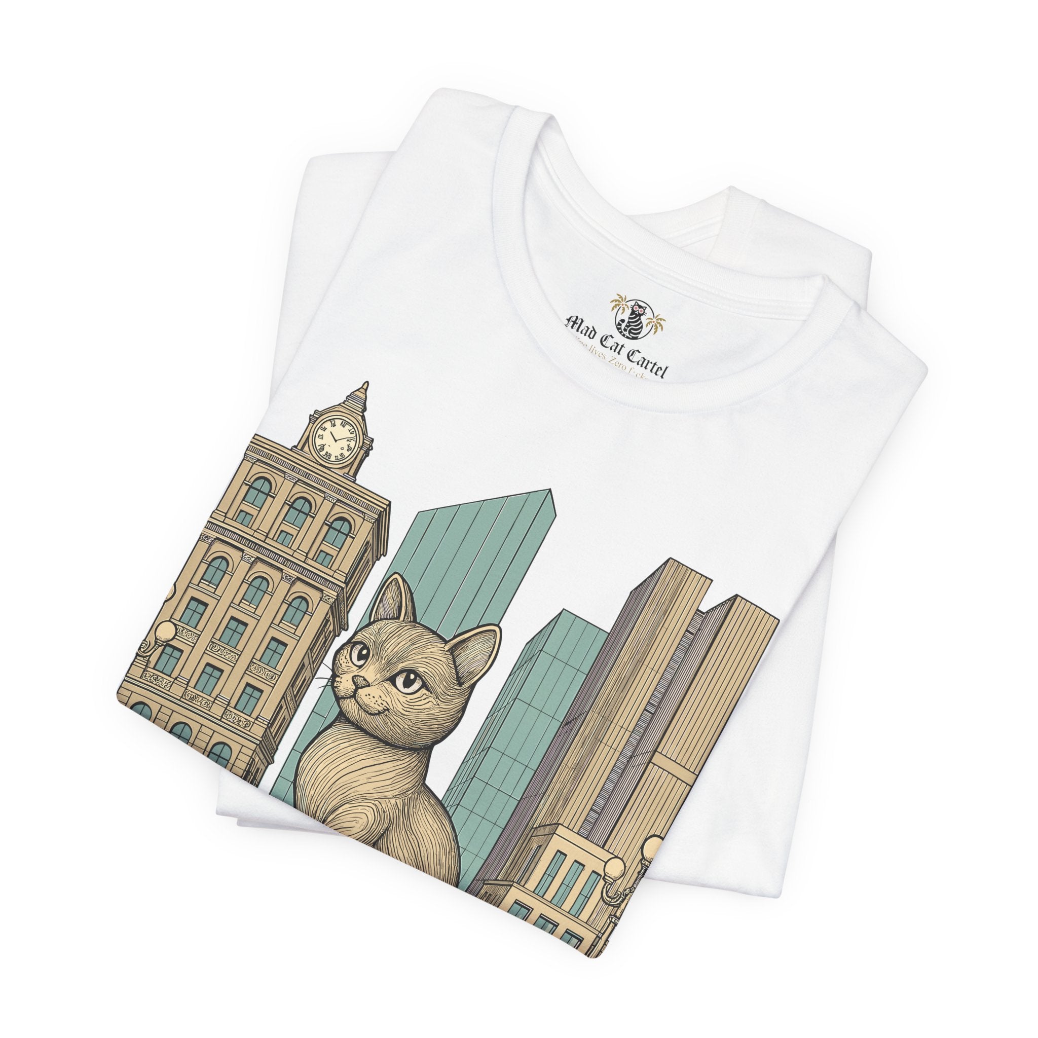 Cat t shirts for guys – white unisex tee folded, Meowschino city cat statue graphic visible