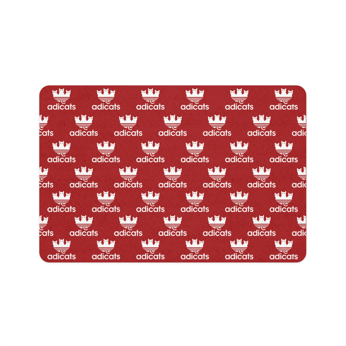 cat feeding red mat with white 'adicats' logo pattern on a white background