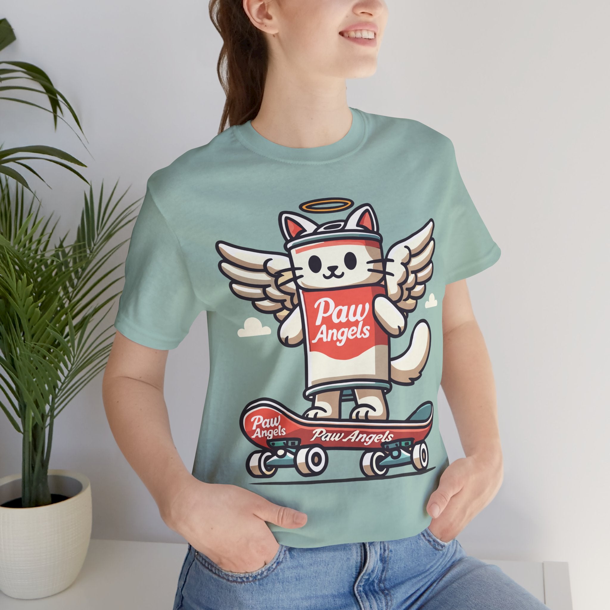 Woman wearing dusty blue Paw Angels skate t shirt – funny cat shirts for women