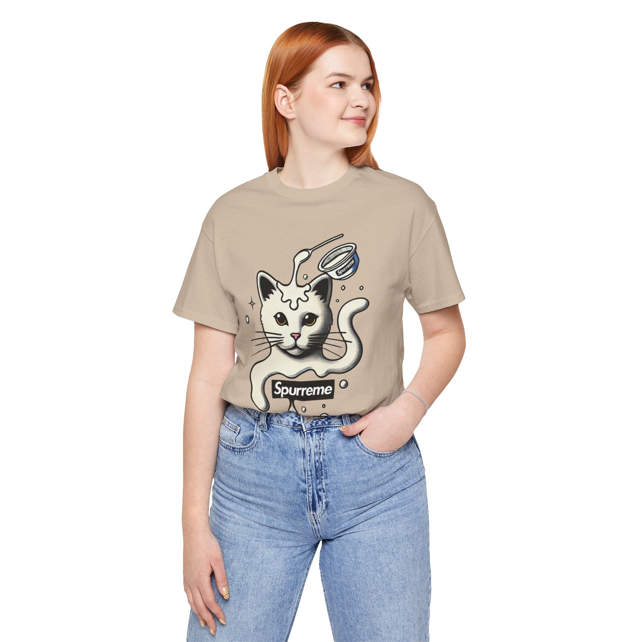 Spurreme Milky Mischief Cat Graphic T-Shirt in tan, worn by a female model