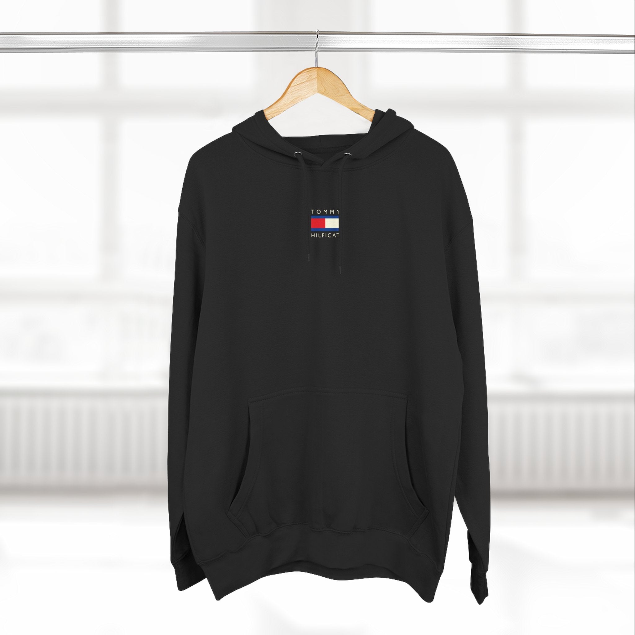 Tommy Hilficat Chest Logo Colorwave Cat Graphic Hoodie in black, on a hanger