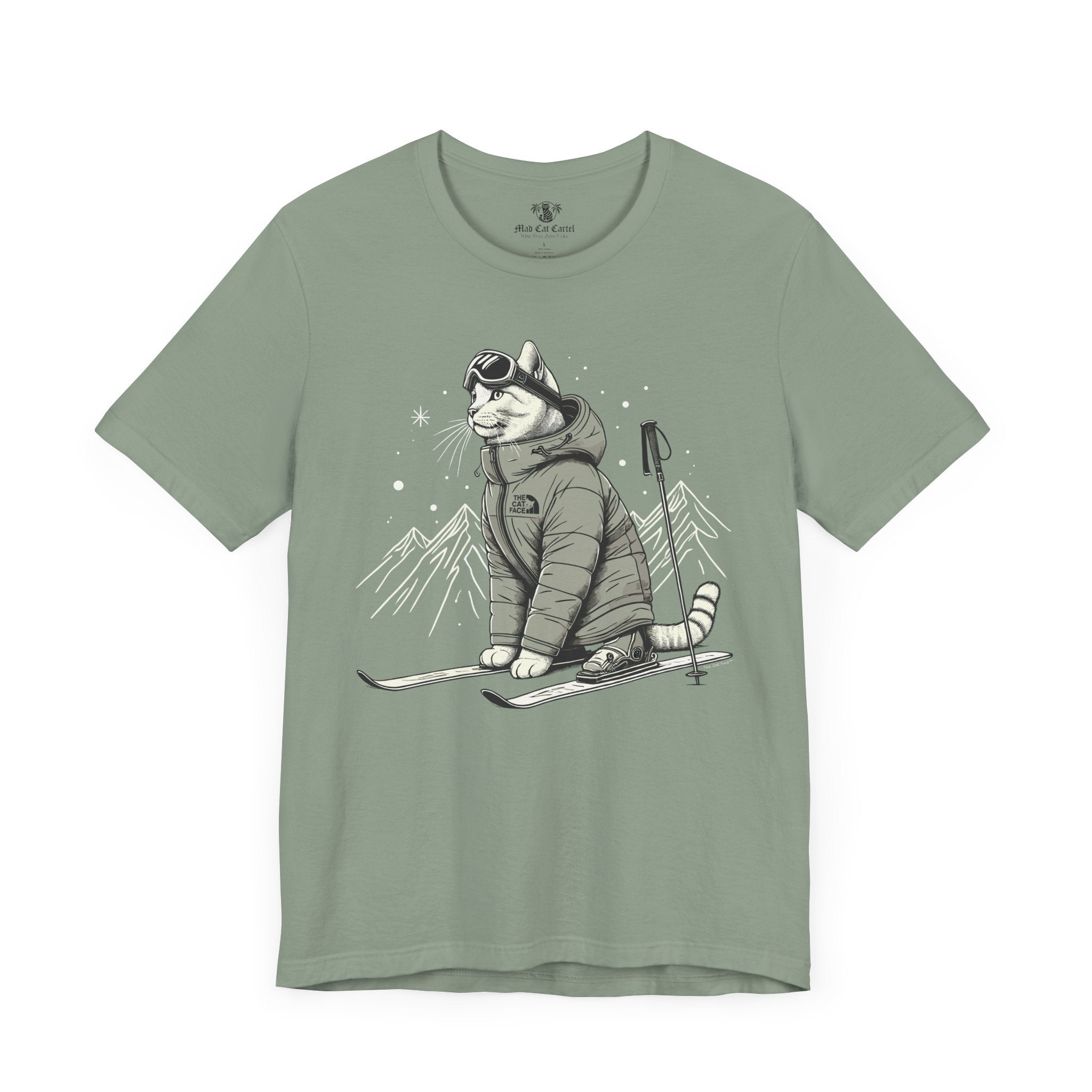 The Cat Face Alpine Explorer Graphic T-Shirt in sage flat lay, cat clothes for humans