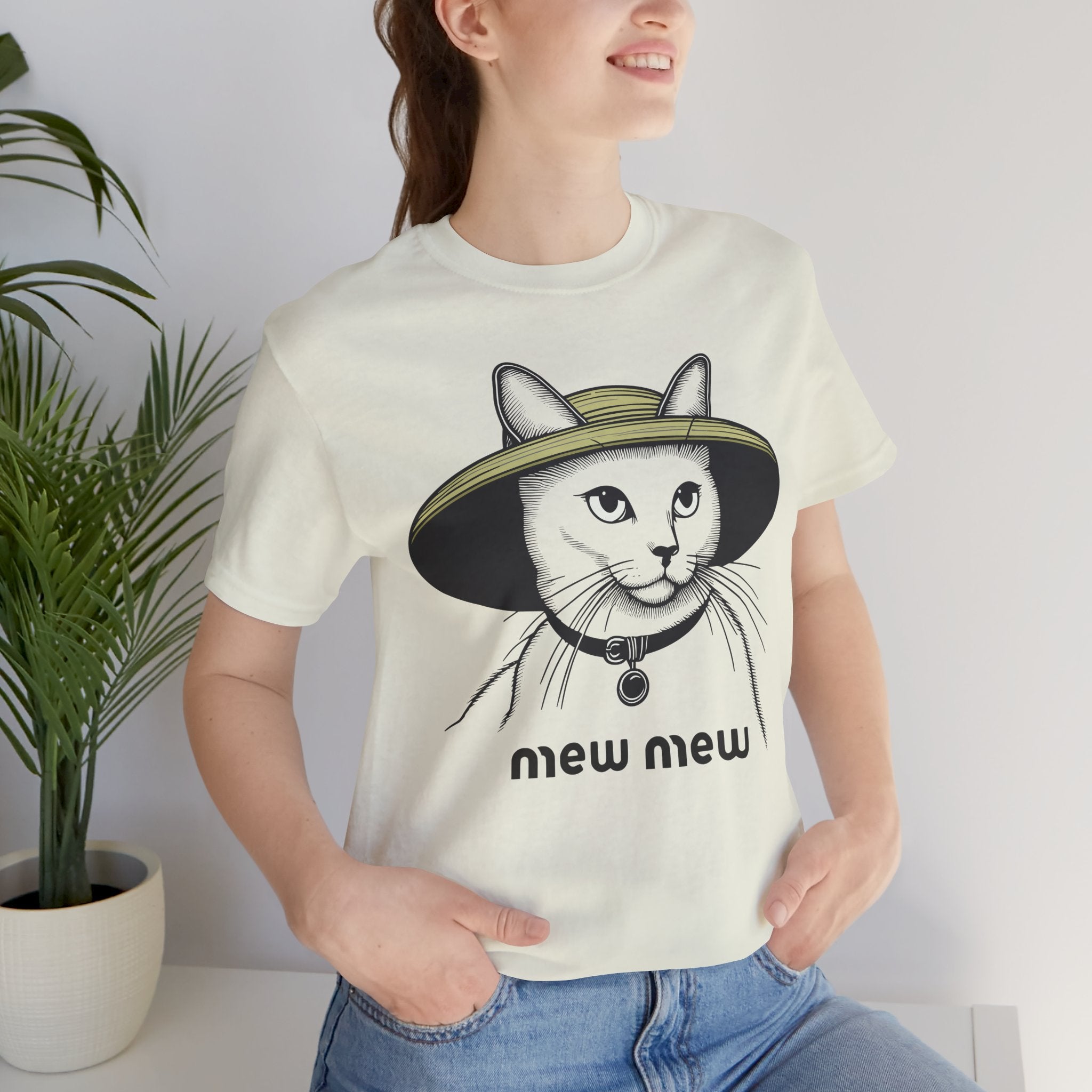 Cat graphic t shirt – citron unisex tee worn by female model, Mew Mew cat in wide-brim hat print