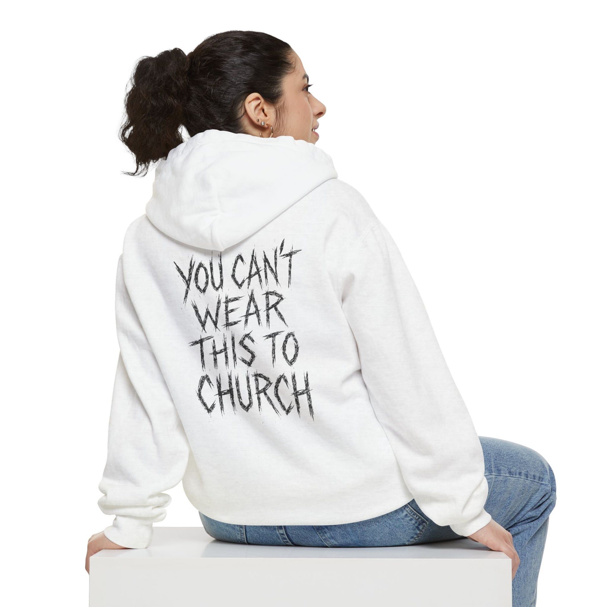 Woman sitting showing back of Purrada White Cat Hoodie, slogan design