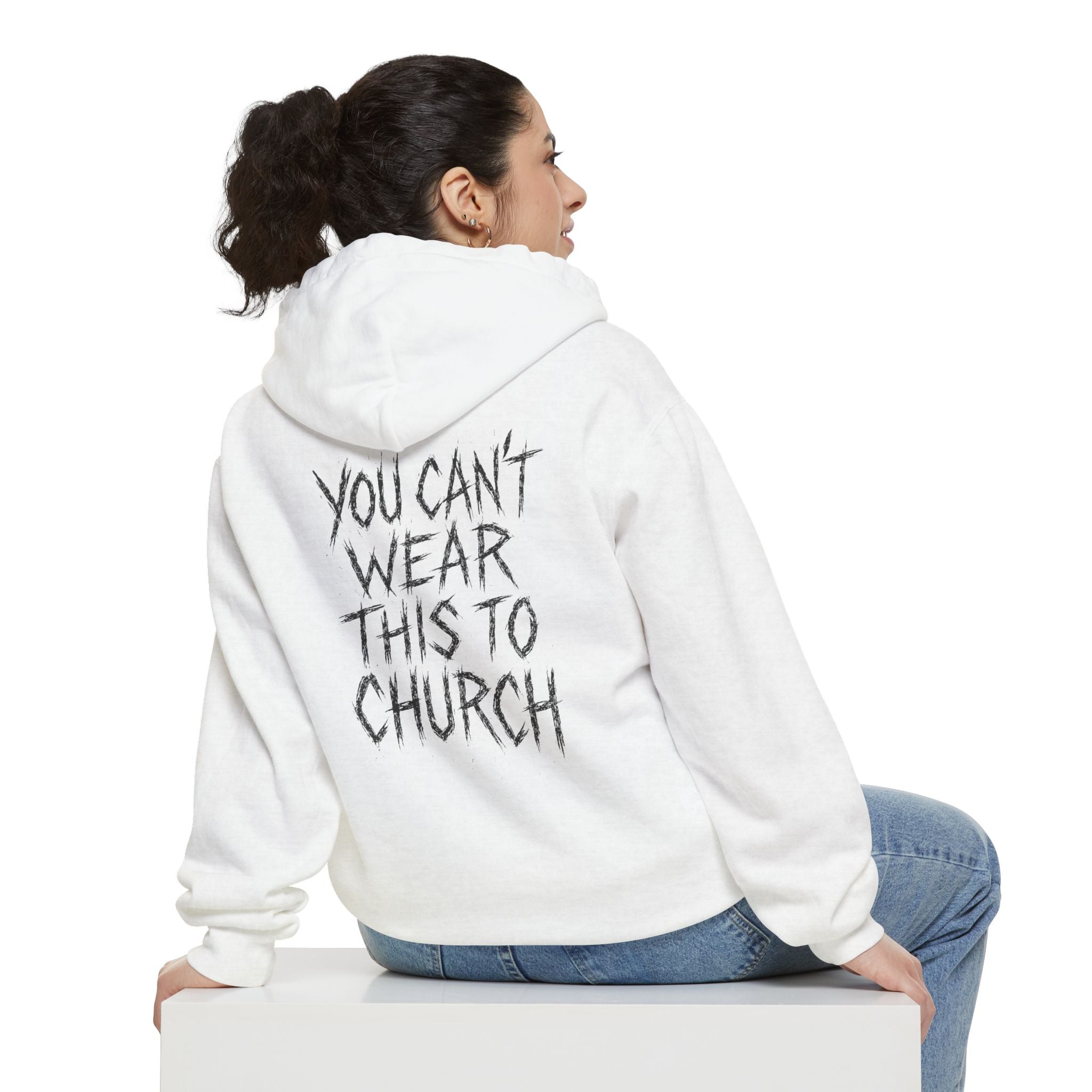Woman sitting showing back of Purrada White Cat Hoodie, slogan design