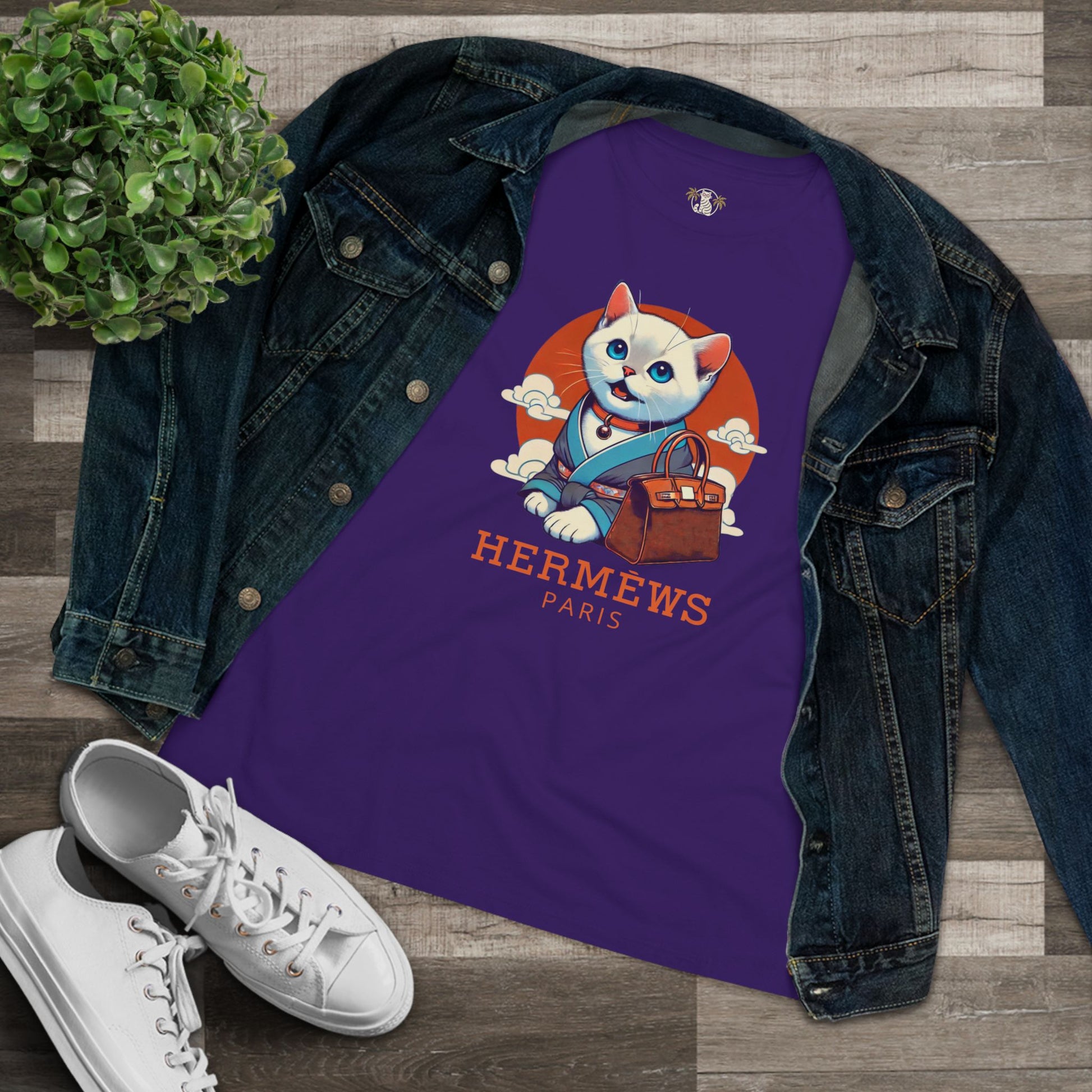 Flat lay Hermèws Paris Cat Purple Graphic T Shirt with denim jacket