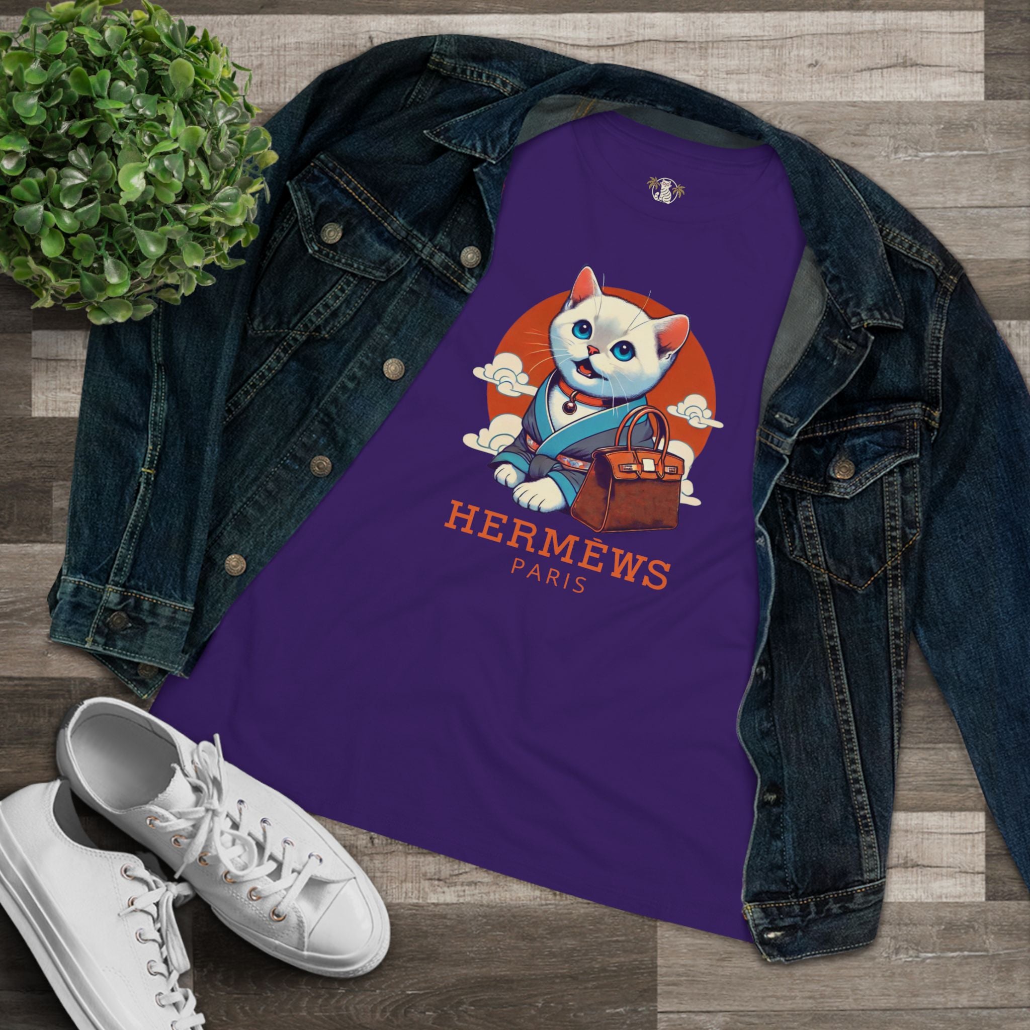 Flat lay Hermèws Paris Cat Purple Graphic T Shirt with denim jacket