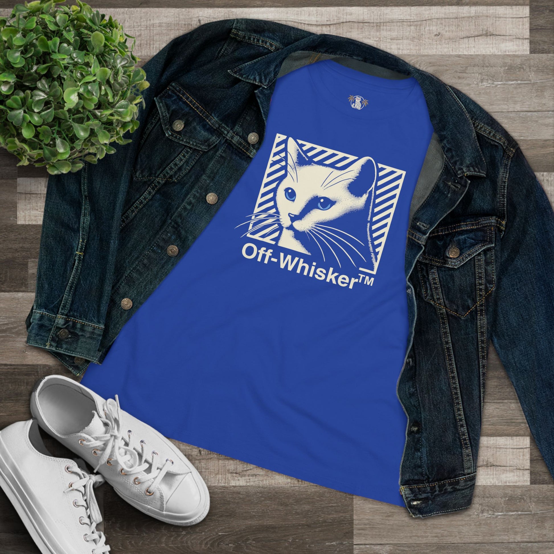 Off-Whisker Blue-Eyed Cat Graphic Women's T Shirt Blue, folded with denim jacket flatlay