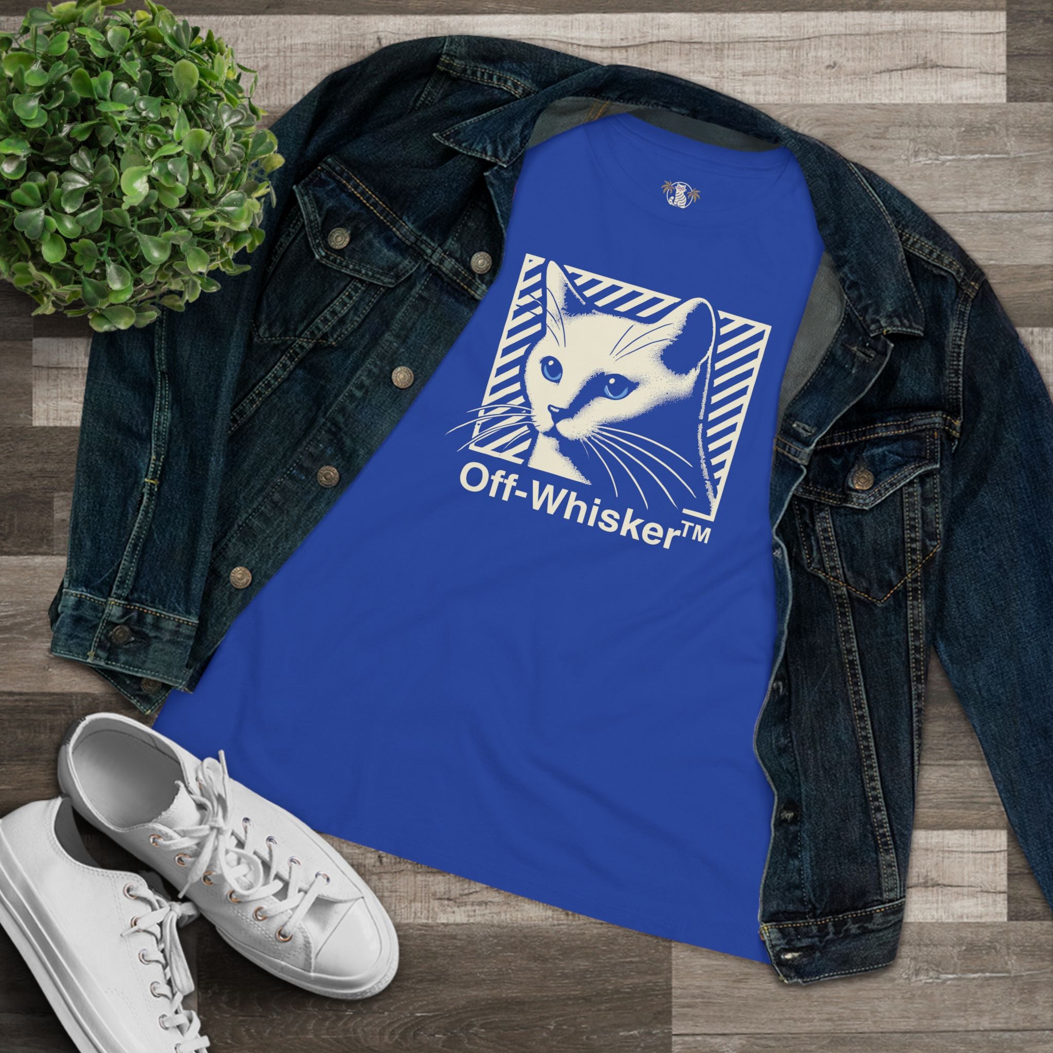 Off-Whisker Blue-Eyed Cat Graphic Women's T Shirt Blue, folded with denim jacket flatlay