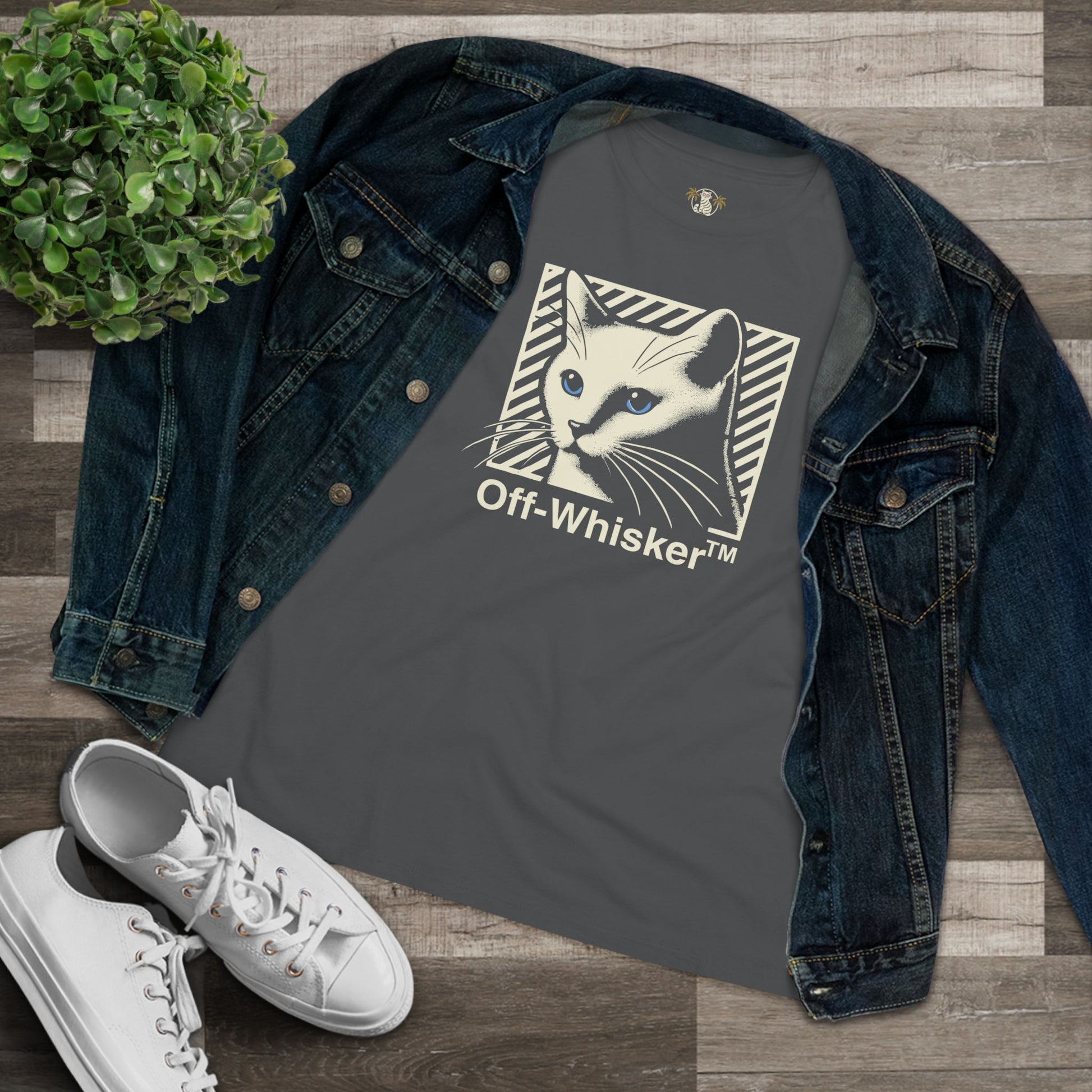 Off-Whisker Blue-Eyed Cat Graphic Women's T Shirt Asphalt Gray, folded with denim jacket flatlay