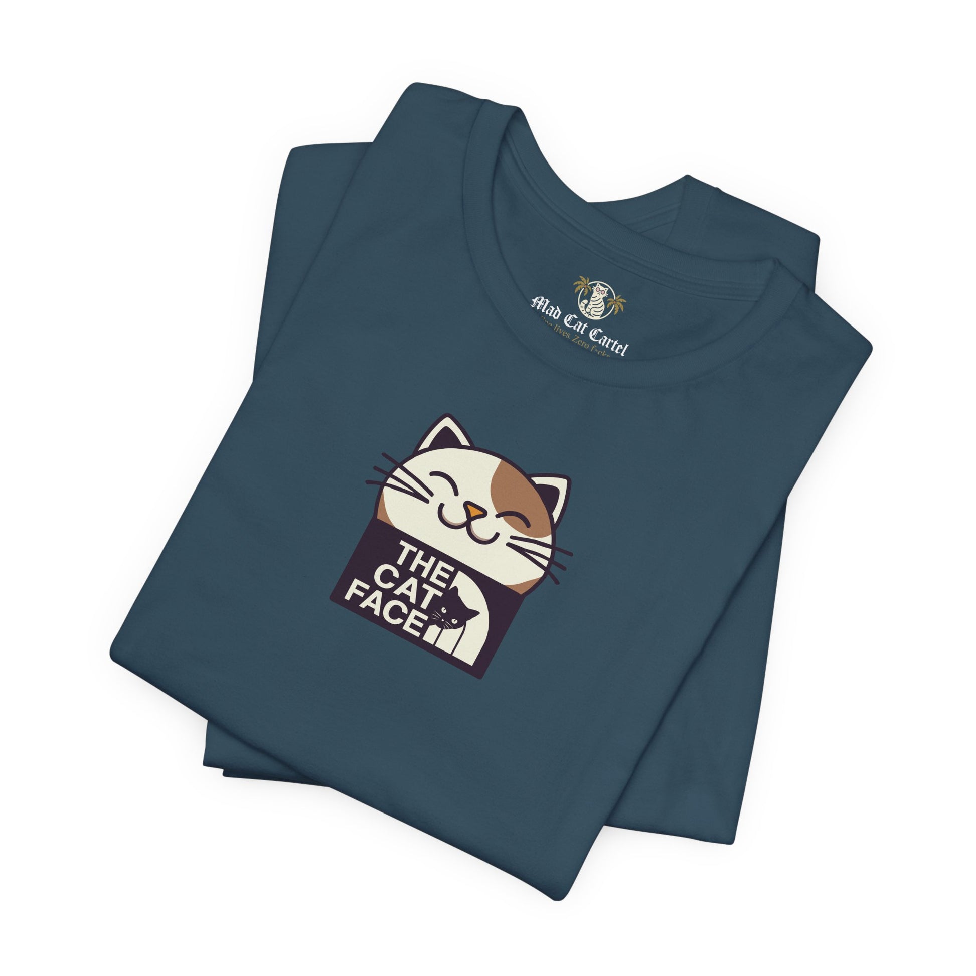 Cat face shirt deep teal flat lay folded