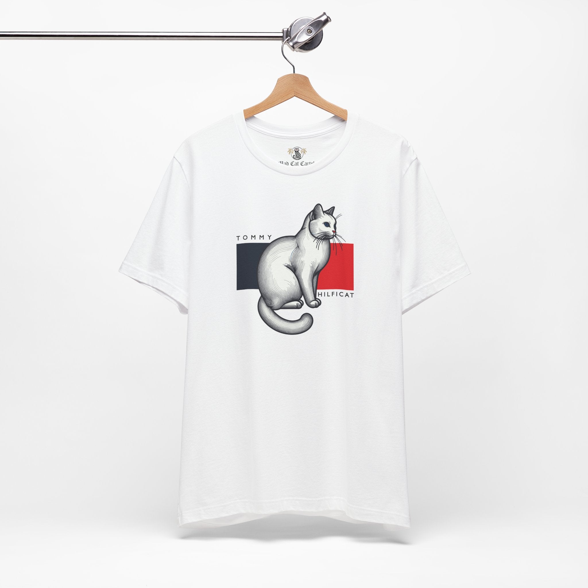White cat on a shirt front on hanger