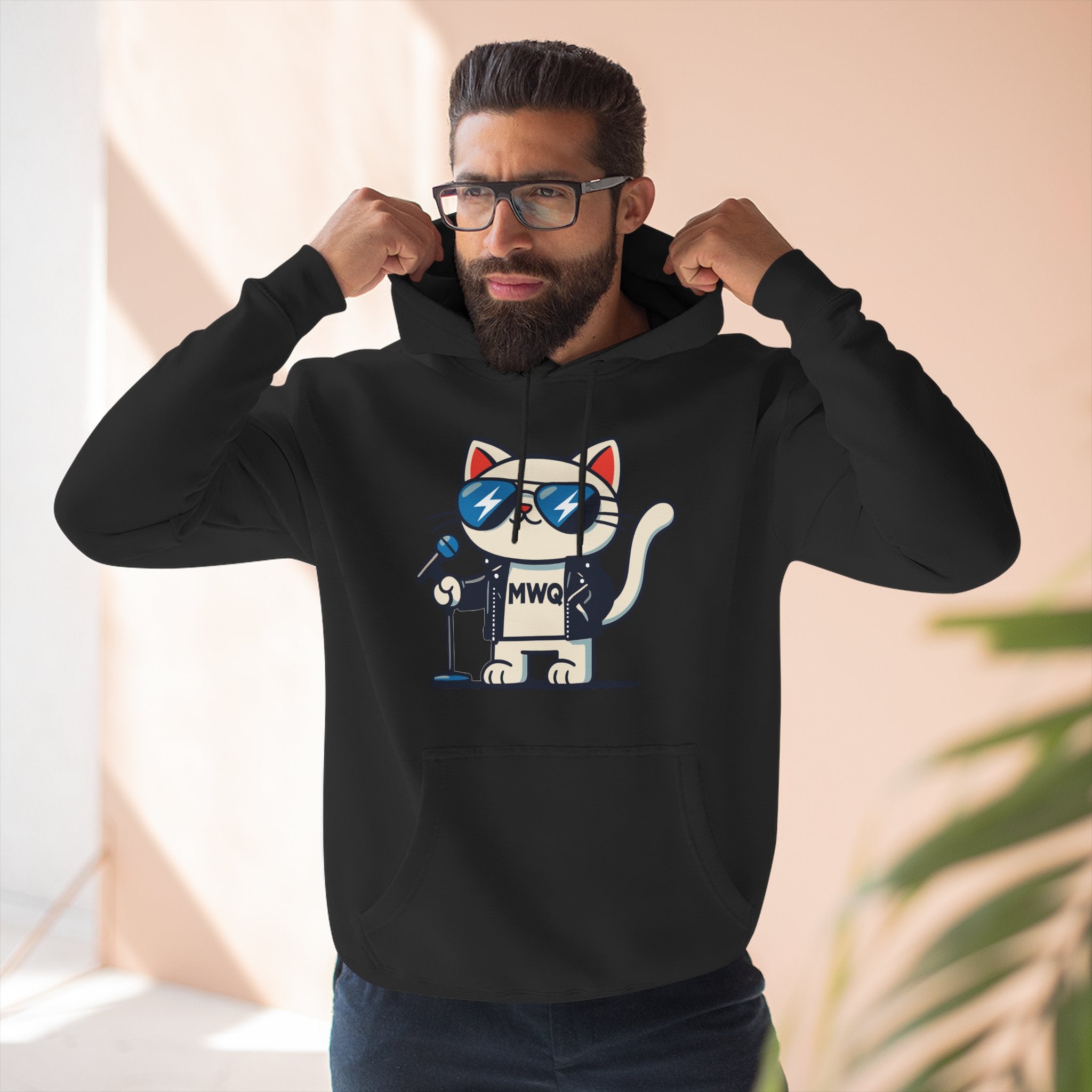 Model posing in Alexander MewQueen cat graphic hoodie indoors, stylish cat themed apparel