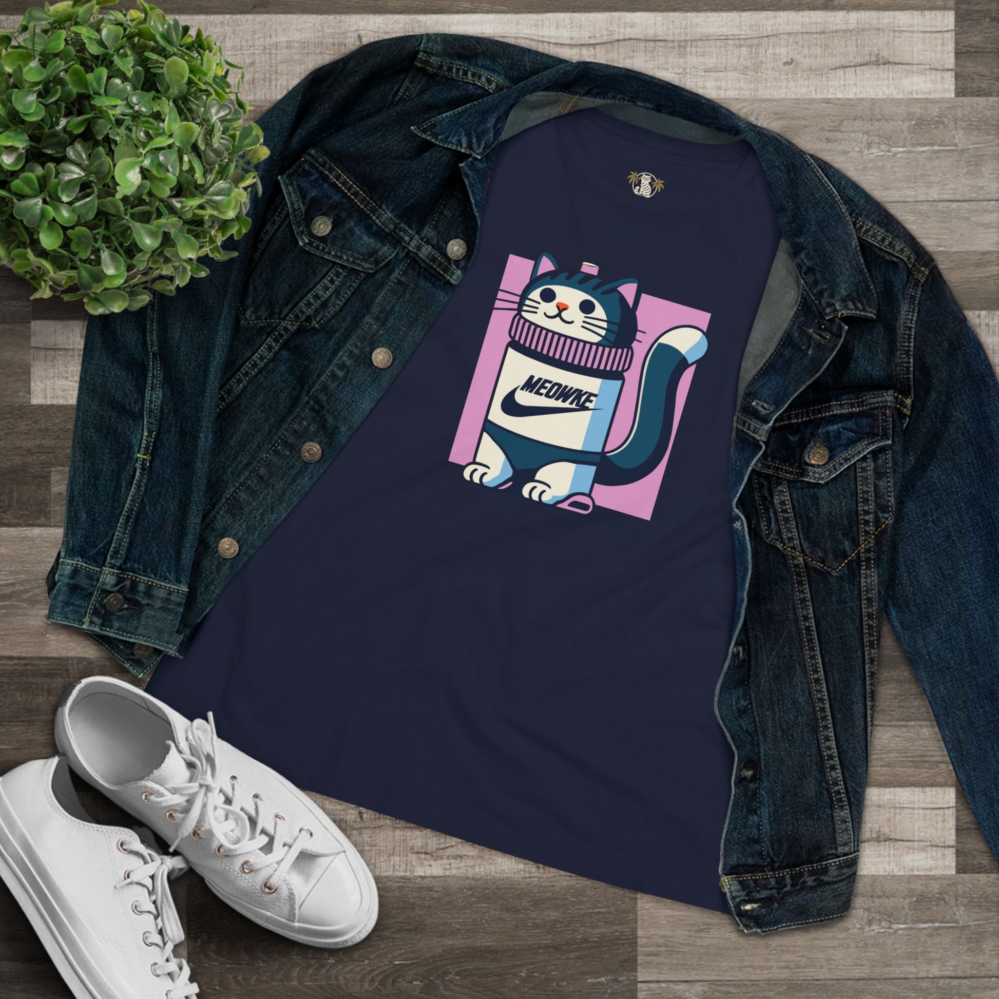 Flat lay navy blue women’s cat graphic t shirt styled with denim jacket