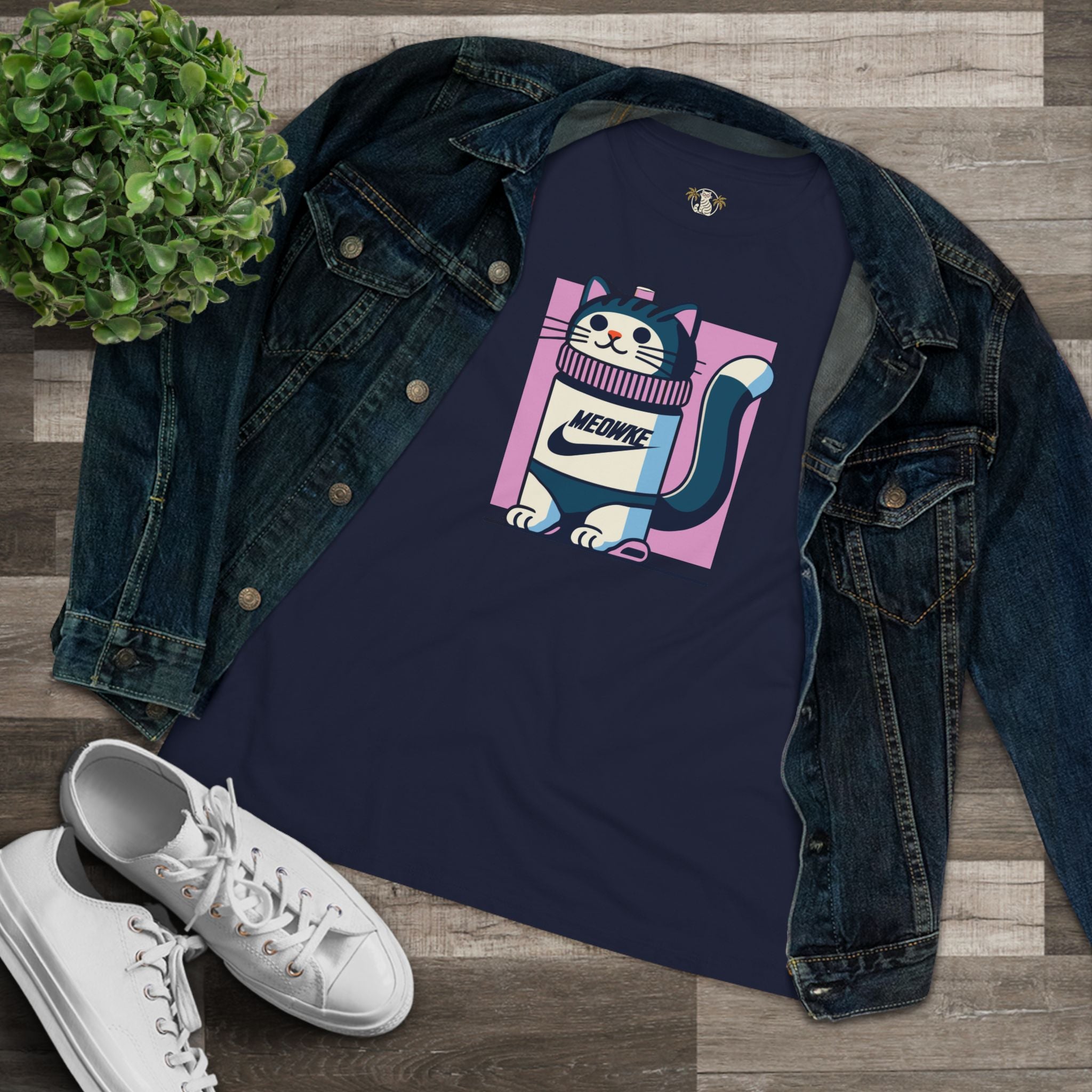 Flat lay navy blue women’s cat graphic t shirt styled with denim jacket