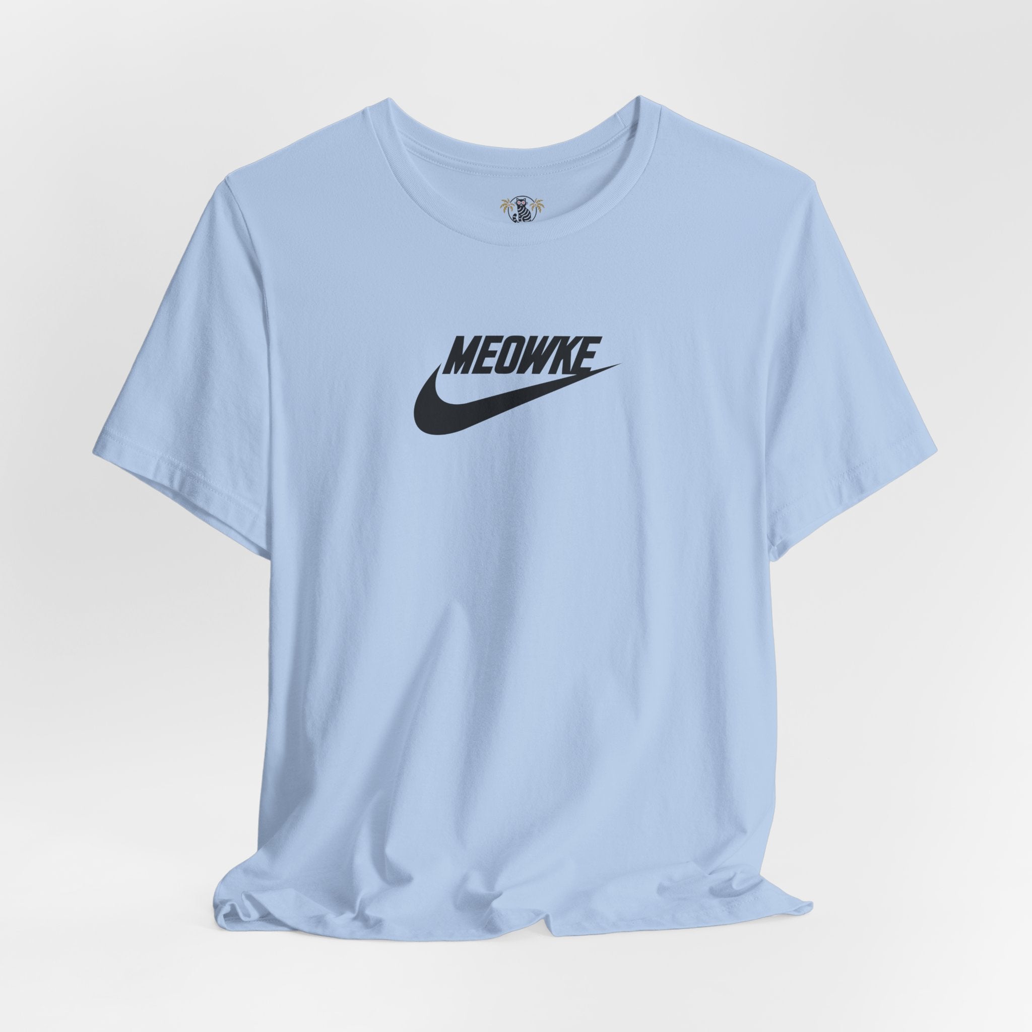 Cat t shirt for men and women – baby blue unisex tee, flat lay, black Meowke chest logo