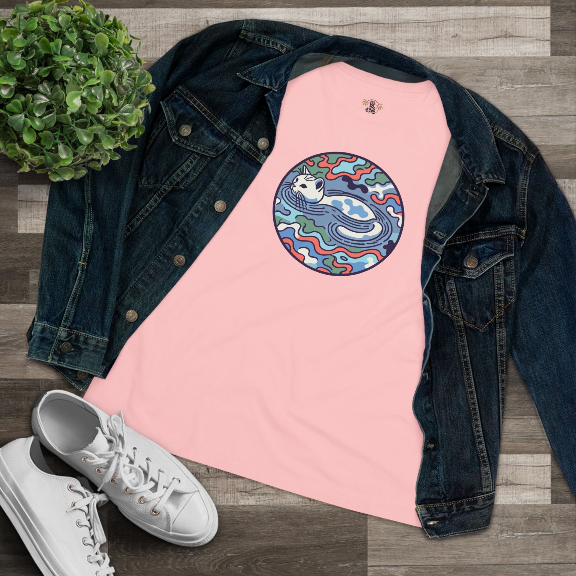 Pink cat graphic tee women’s folded flat lay with jacket and shoes