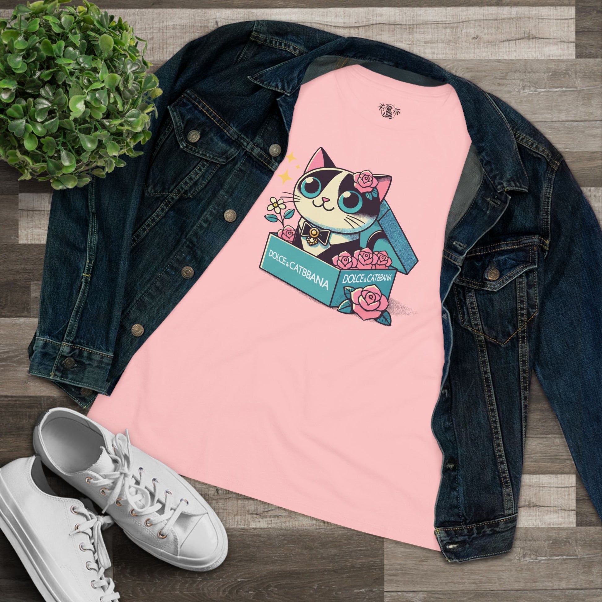 Pink cat themed apparel styled with denim flat lay