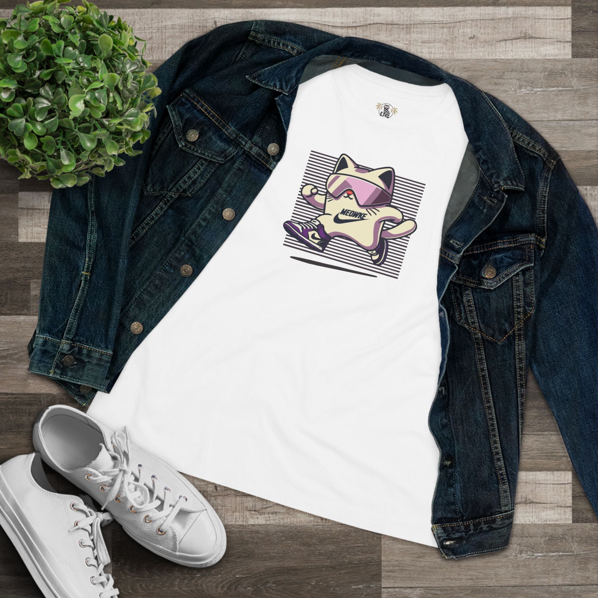 White women's t shirt flat lay with denim jacket, cat graphic t shirt