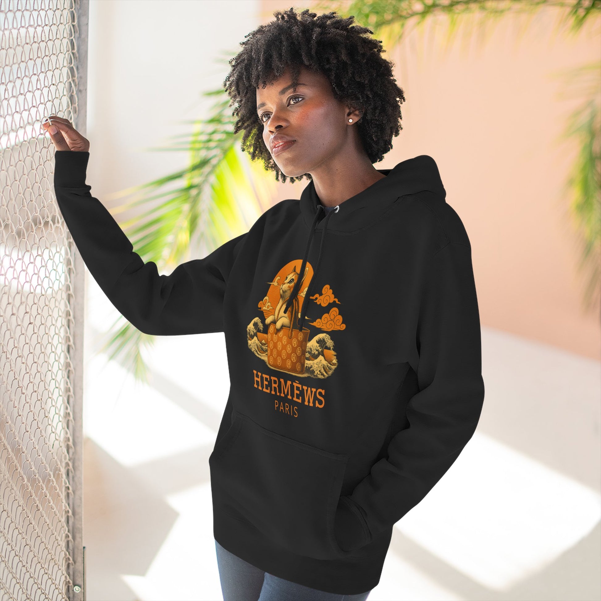 Woman wearing Hermèws black hoodie indoors, cat hoodie for woman