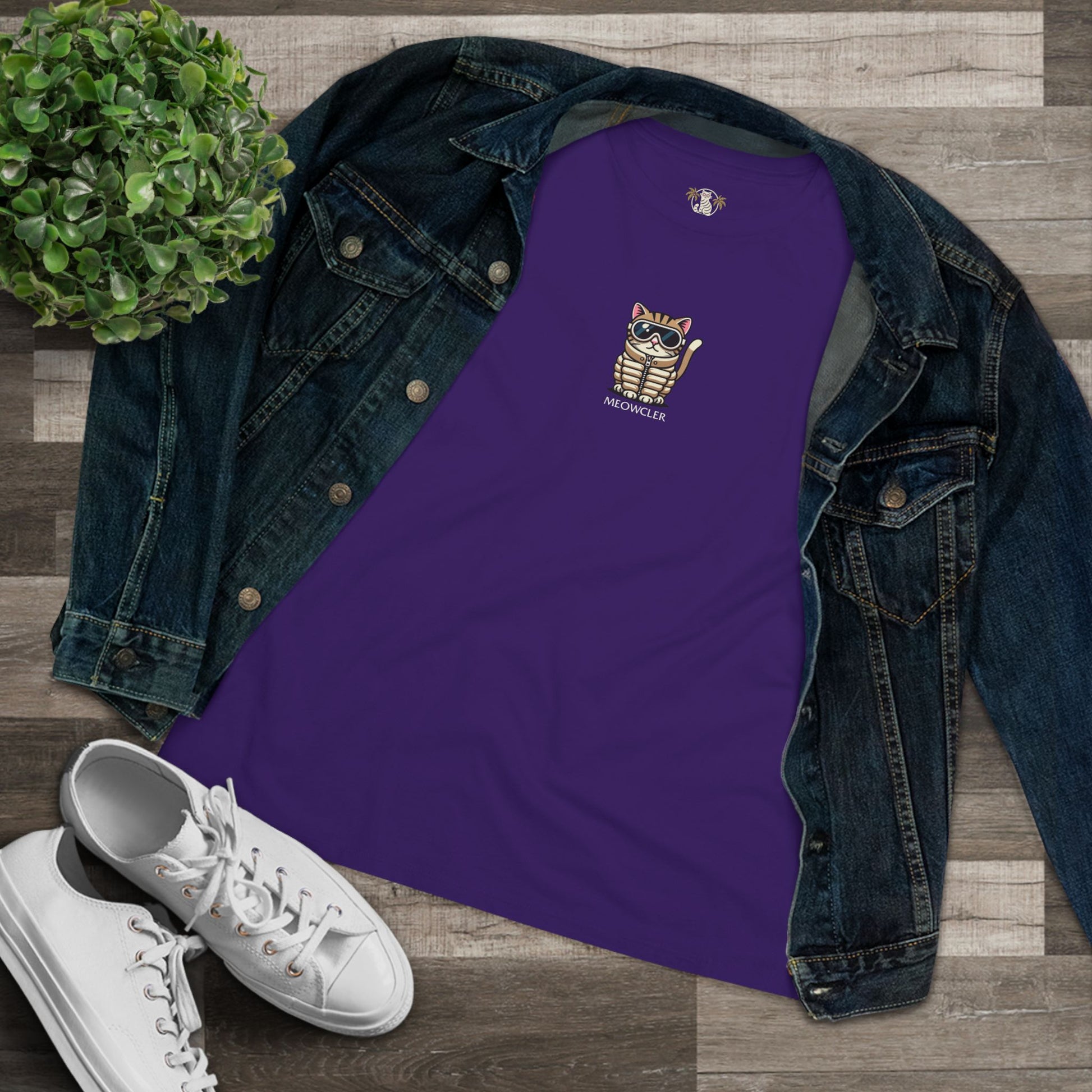 Flat lay team purple cat tee styled with denim jacket, items for cat lovers