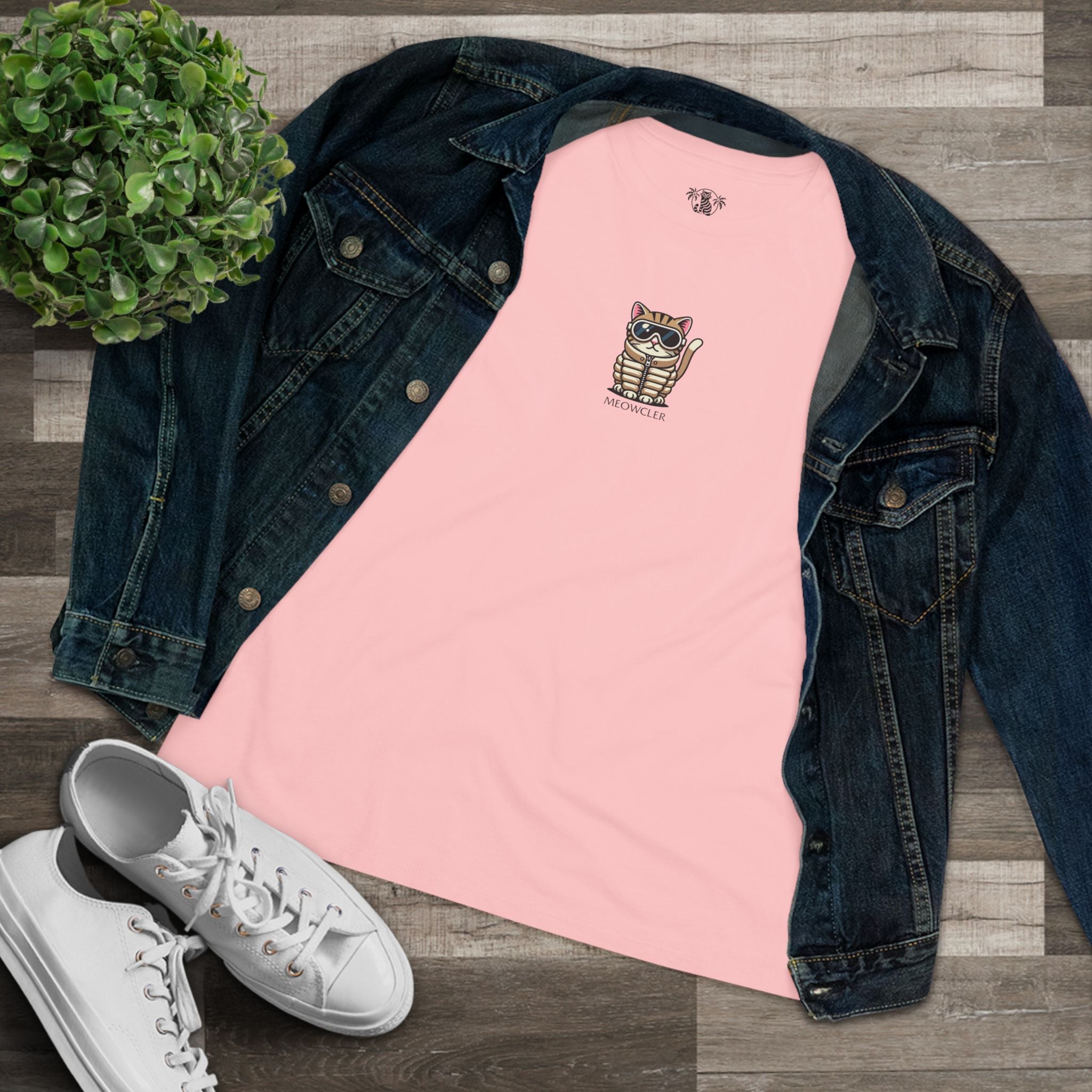 Flat lay pink Meowcler women’s cat tee styled with denim jacket