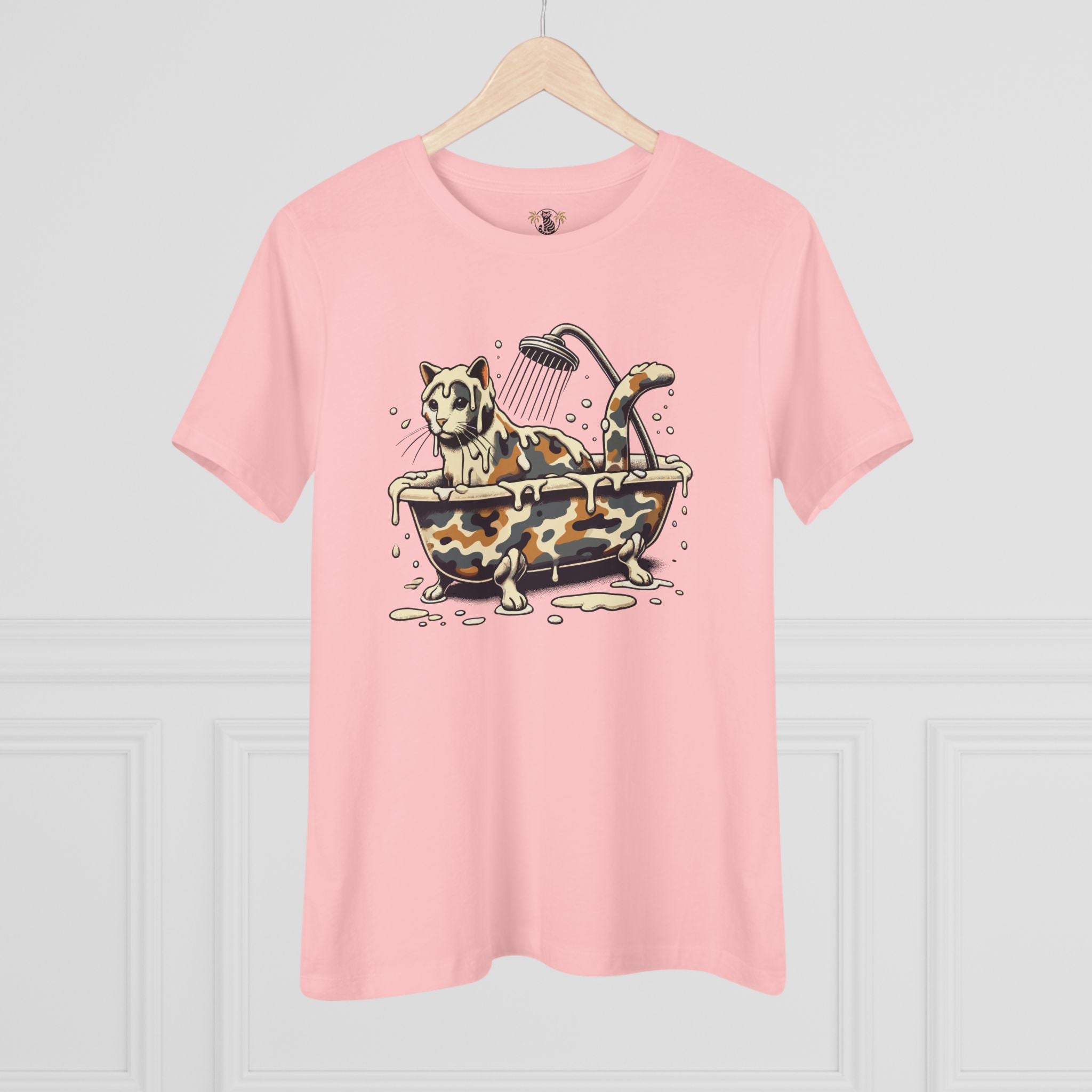 A Bathing Cat Camo Bath Drip Women's Graphic T-Shirt in pink, on a hanger