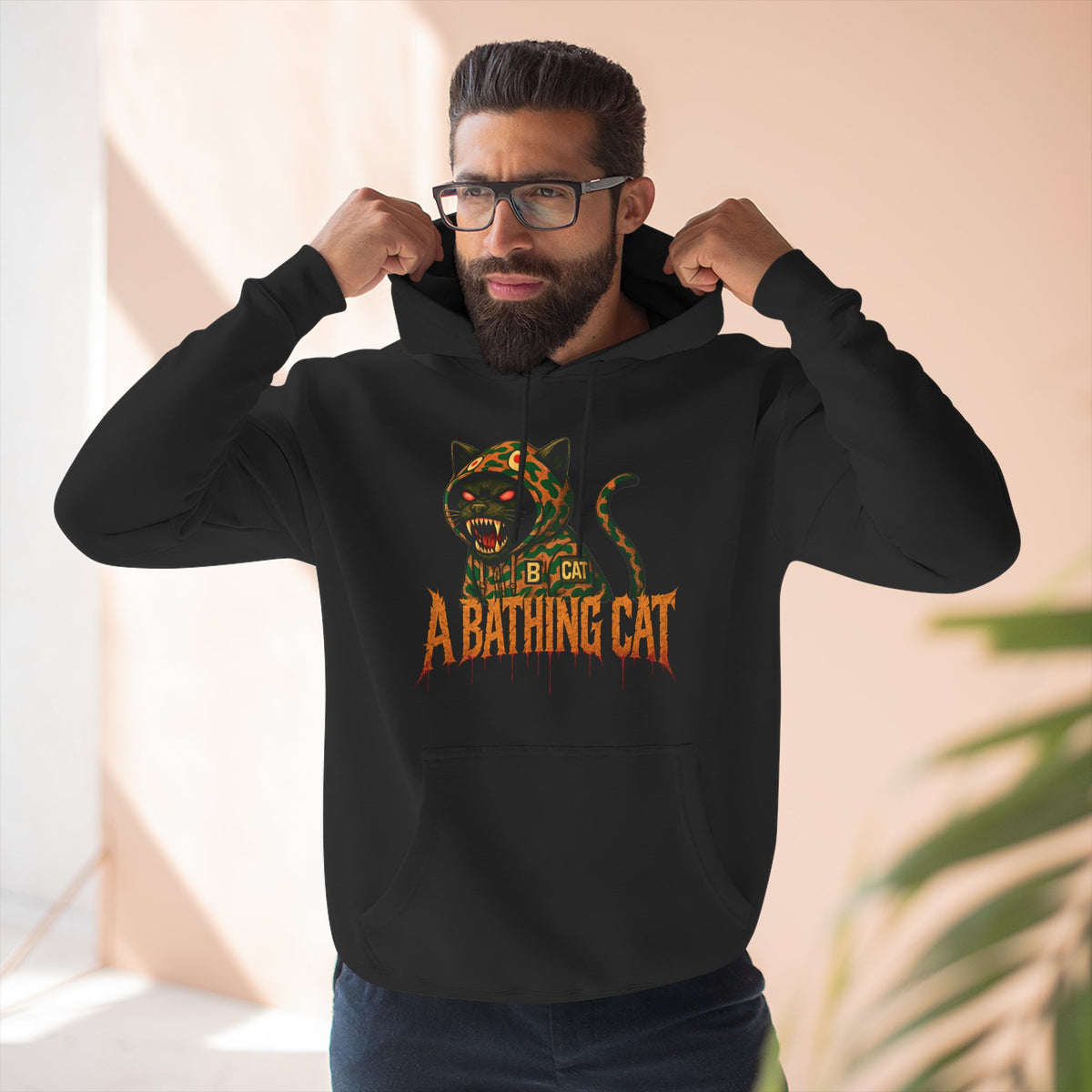 A Bathing Cat Design Jungle Predator Graphic Black Hoodie, worn by a male model