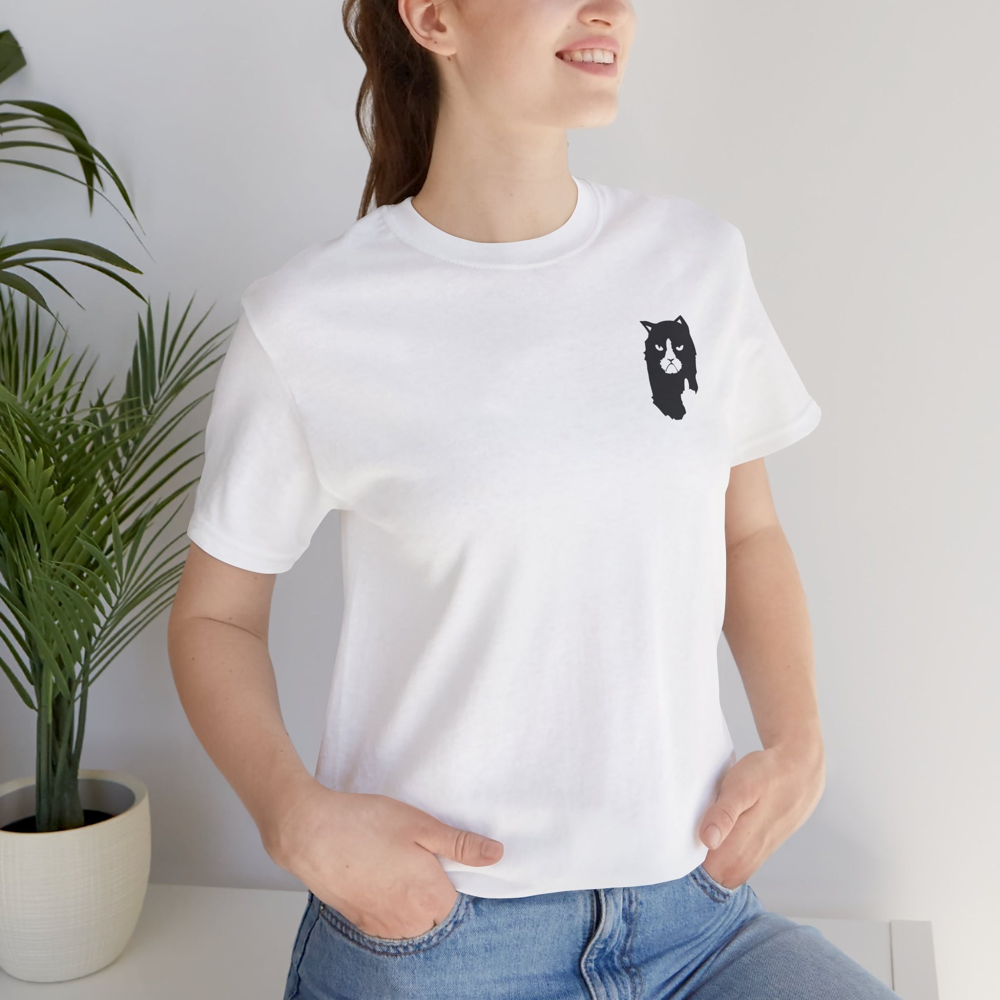 front view of female model wearing white A Bathing Cat logo t shirt, relaxed streetwear look