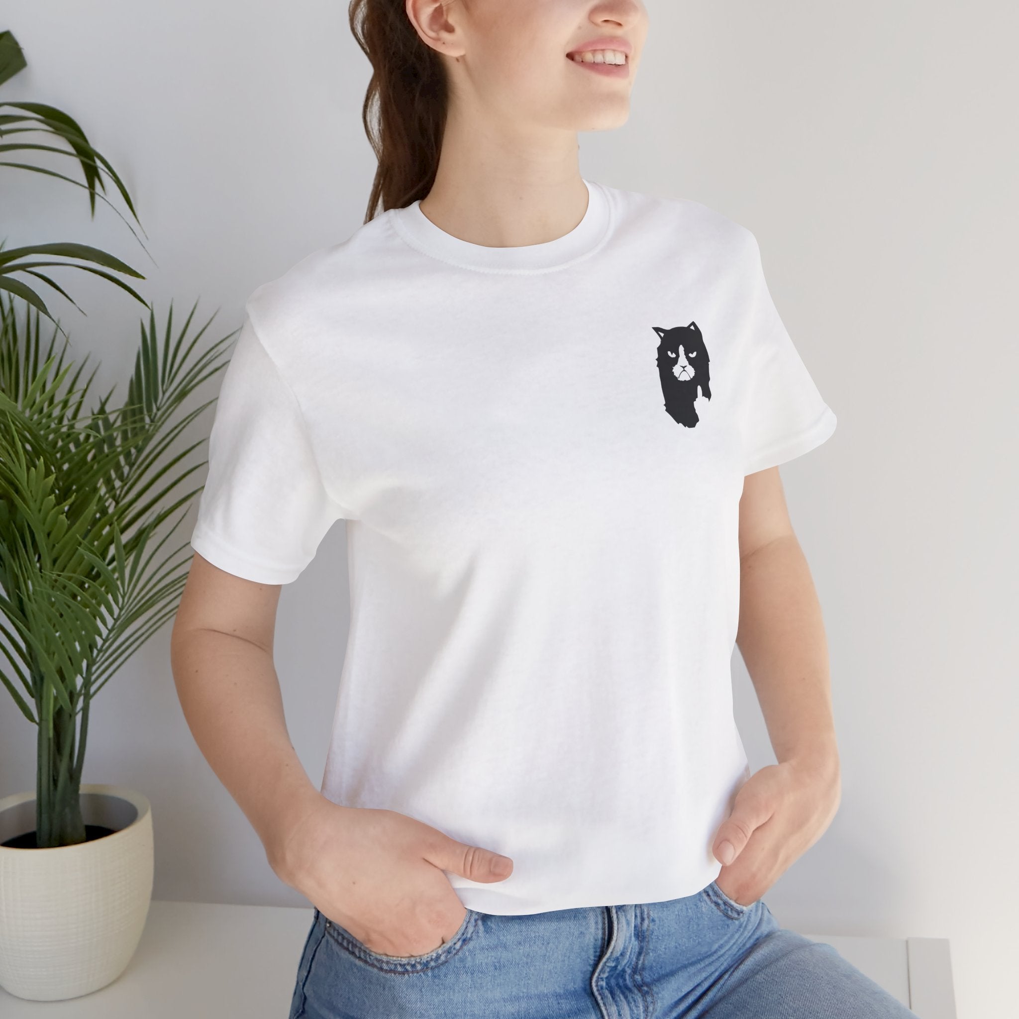 front view of female model wearing white A Bathing Cat logo t shirt, relaxed streetwear look