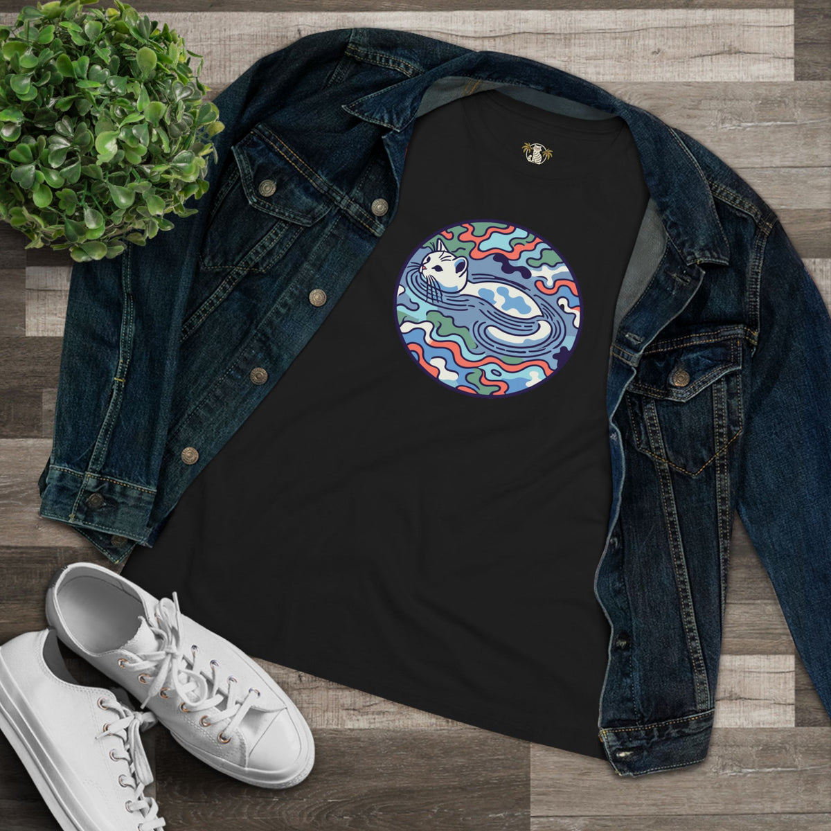 A Bathing Cat Wave Camo Flow Graphic Women's T-Shirt in black, flat lay