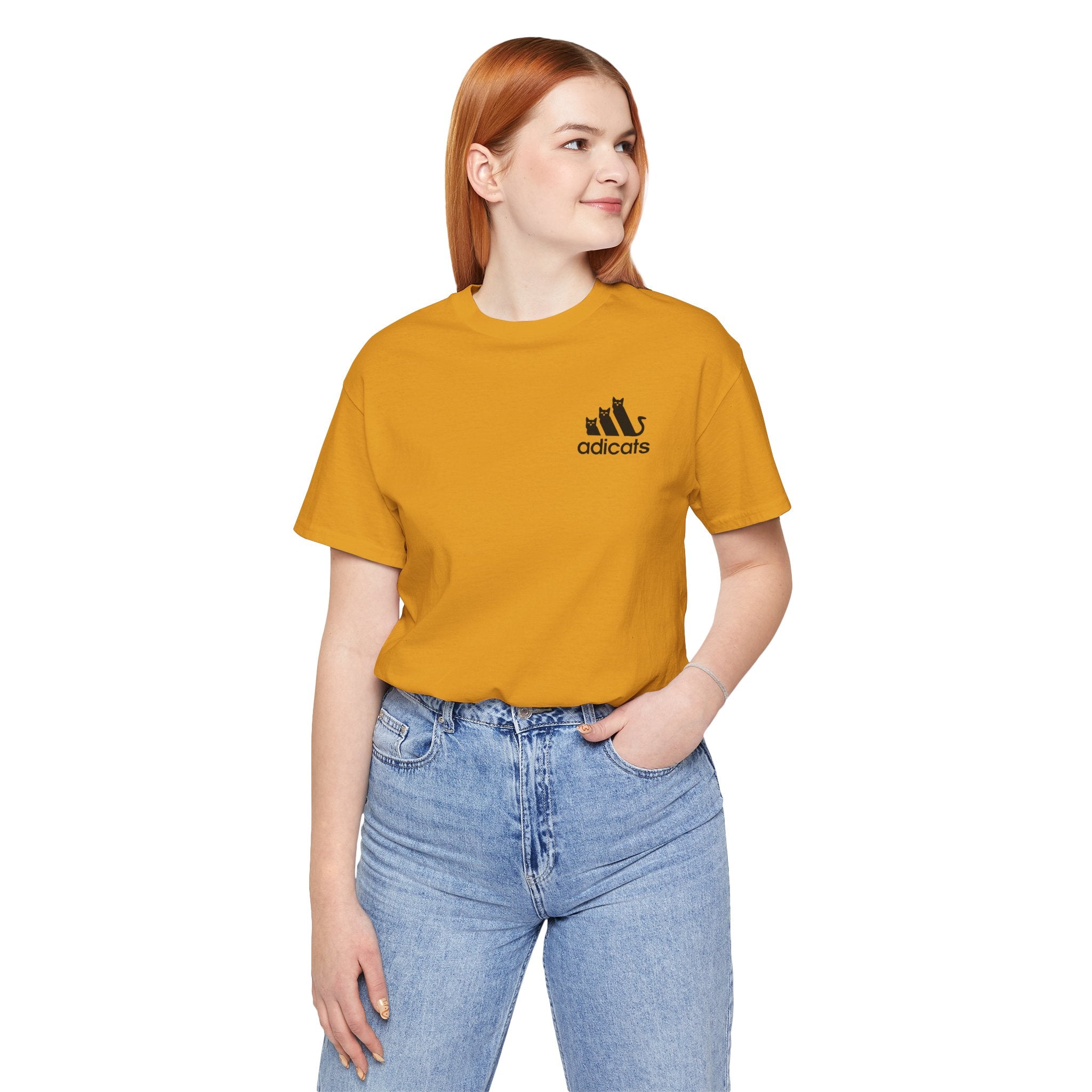 front view of female model in Adicats t shirt in mustard yellow, cotton shirt for cat lovers