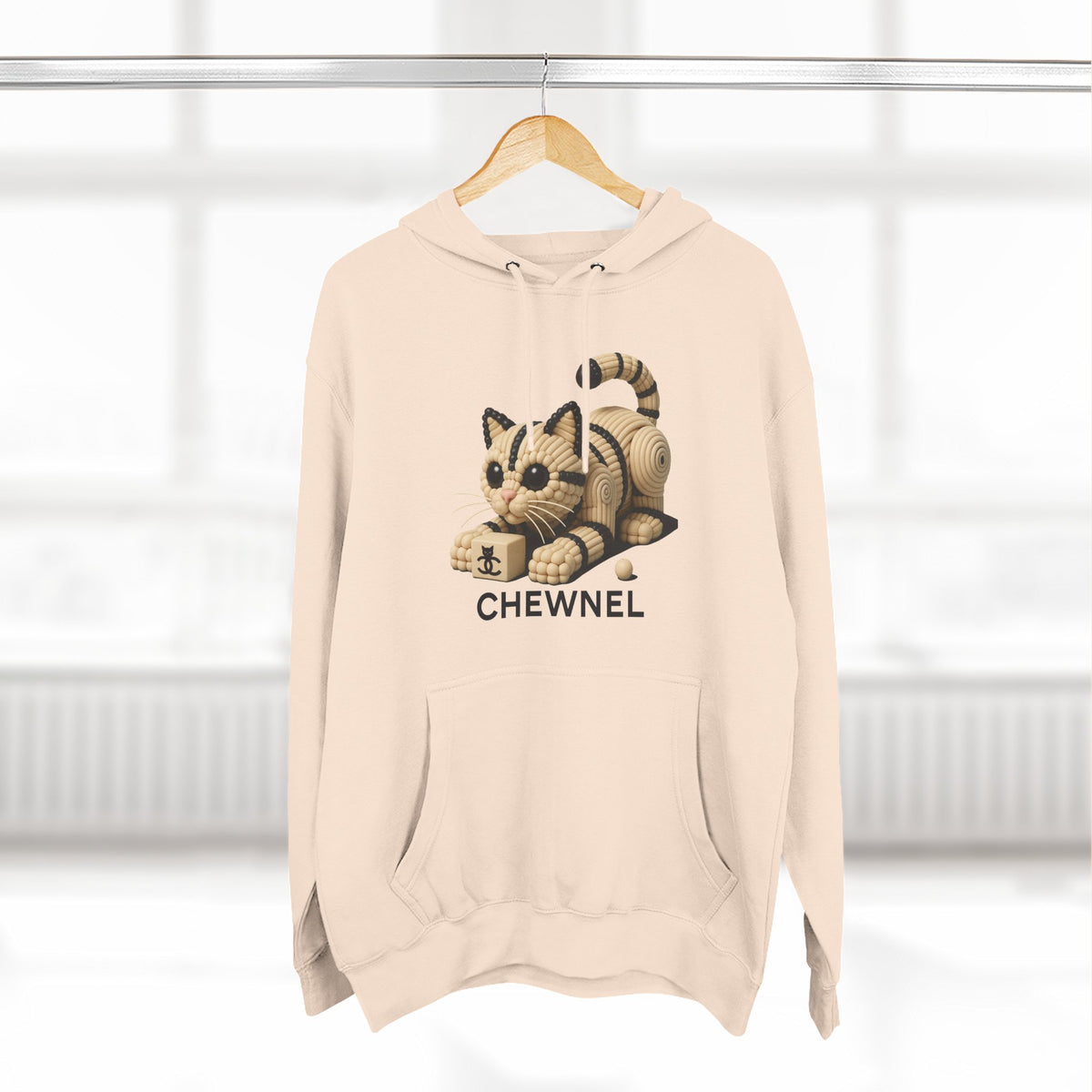 Chewnel Luxury In Pieces Cat Graphic Hoodie in pale pink, on a hanger