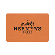 Hermews Paris designer pet feeding mat orange cat food mat with black logo by Mad Cat Cartel