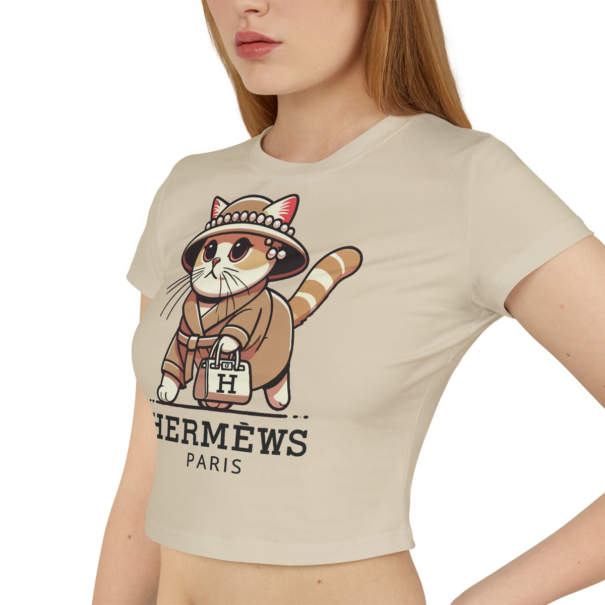 Hermèws Paris Chic Cat Graphic Women's Baby Tee in sand, worn by a model