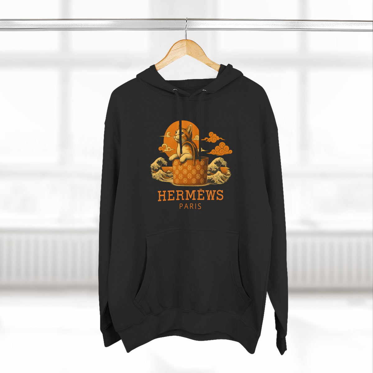 Hermèws Paris Sunset Voyage Cat Graphic Hoodie in black, on a hanger