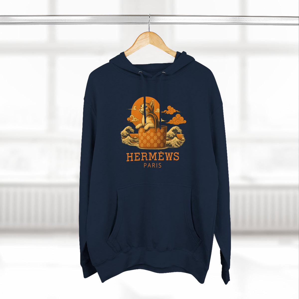 Hermèws Paris Sunset Voyage Cat Graphic Hoodie in navy, on a hanger