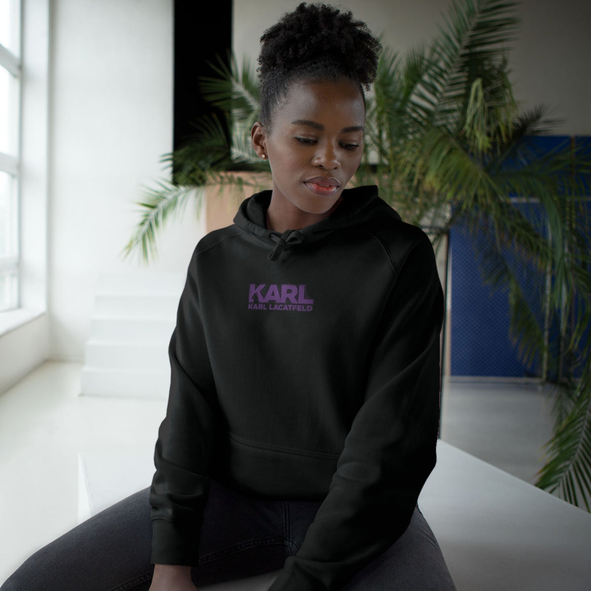 Karl Lacatfeld Chest Logo Purple Glow Cat Graphic Hoodie in black, worn by a female model