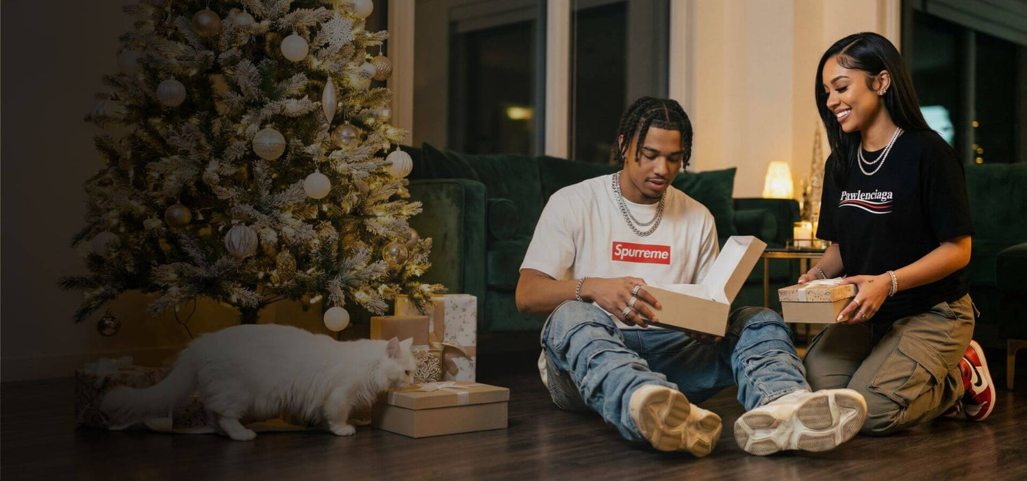 couple opening Christmas gifts, cat lover holiday gift ideas, Mad Cat Cartel streetwear