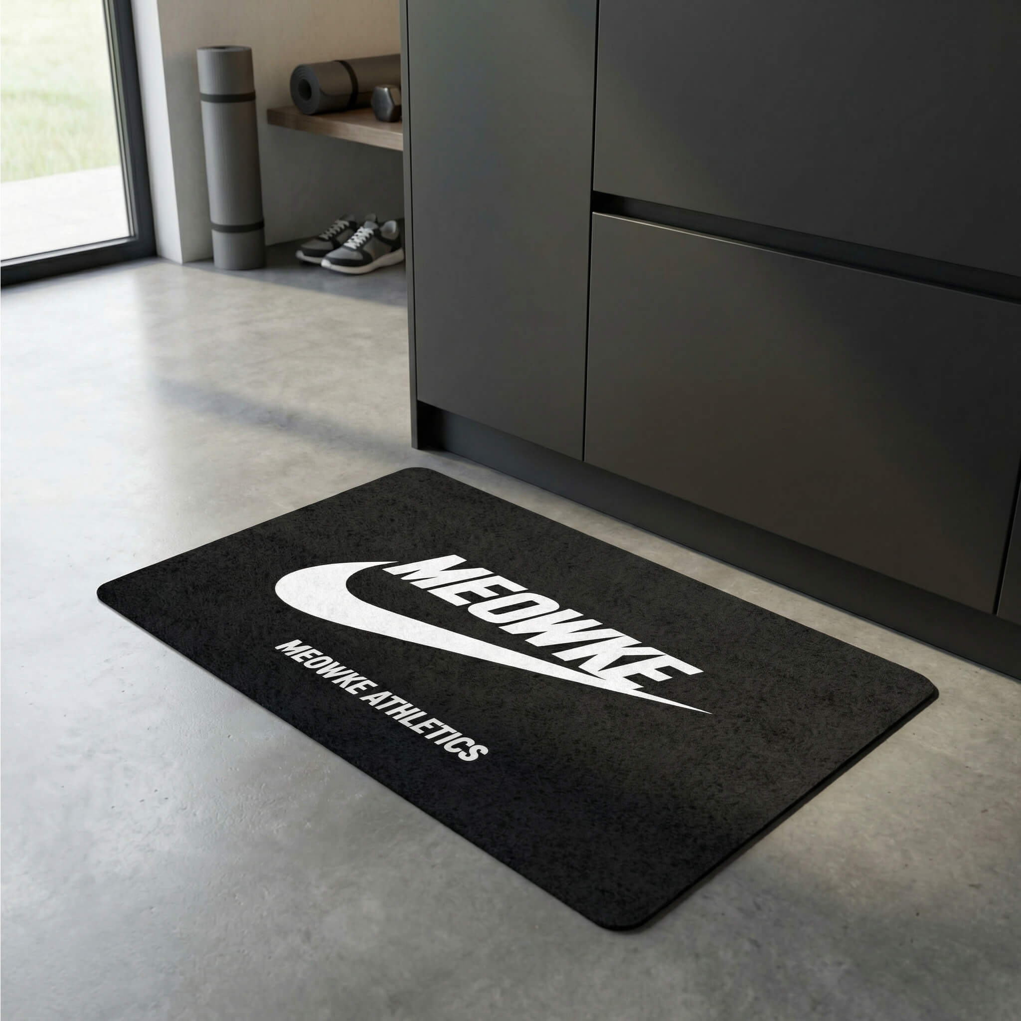 Black cat feeding mat with Meowke Athletics logo by Mad Cat Cartel
