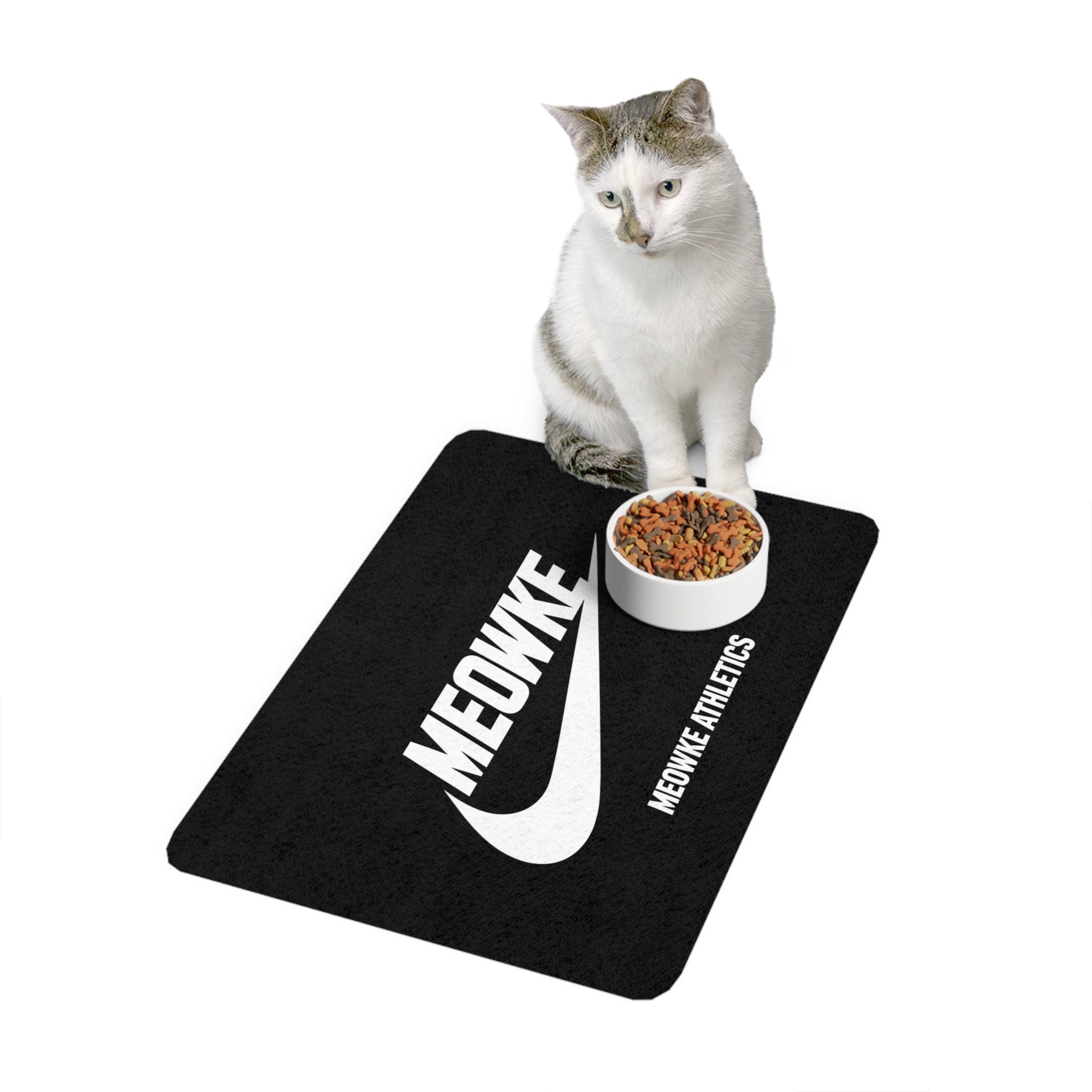 Meowke Athletics cat food mat with seated cat and bowl by Mad Cat Cartel
