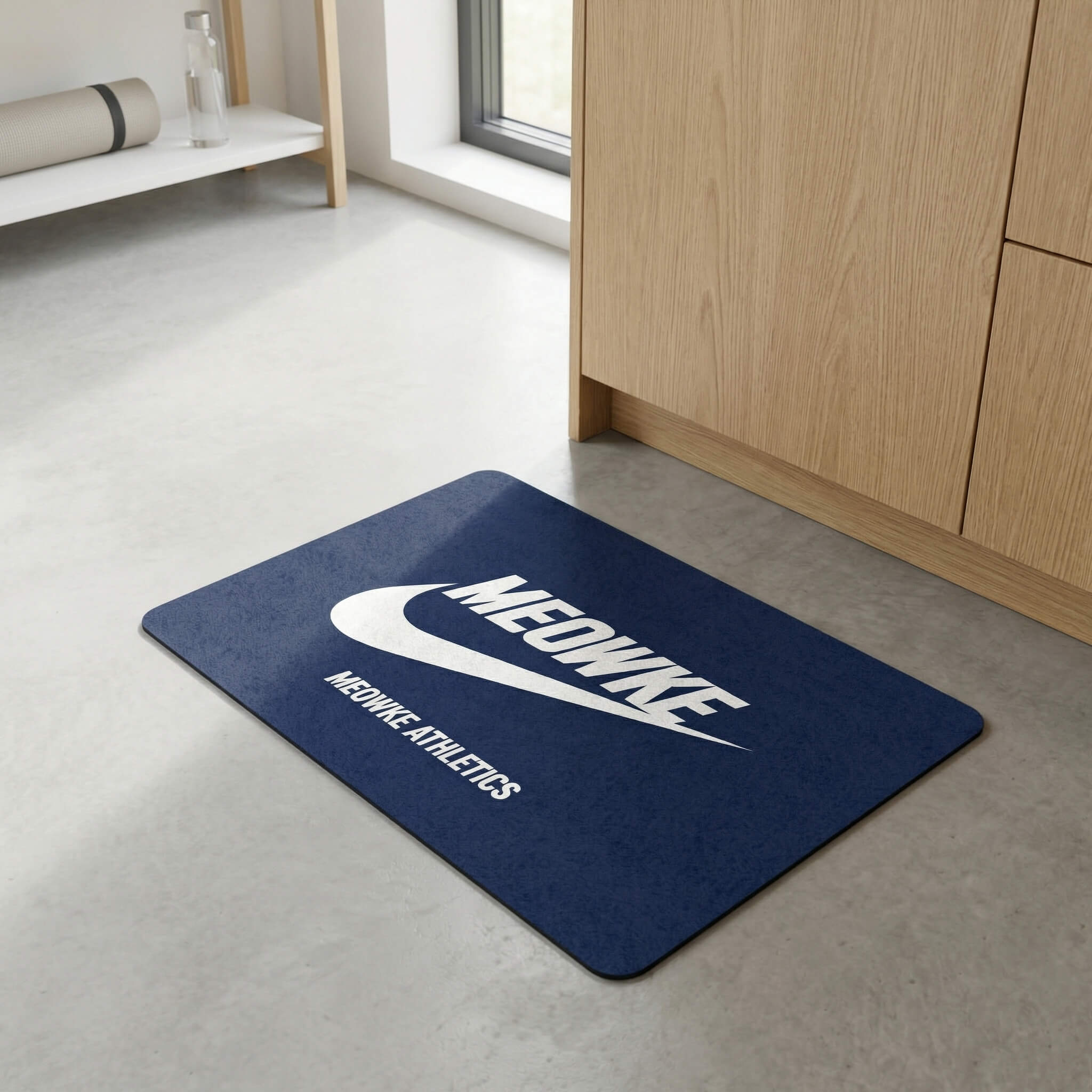 Blue cat feeding mat with Meowke logo placed near cabinet on a clean floor