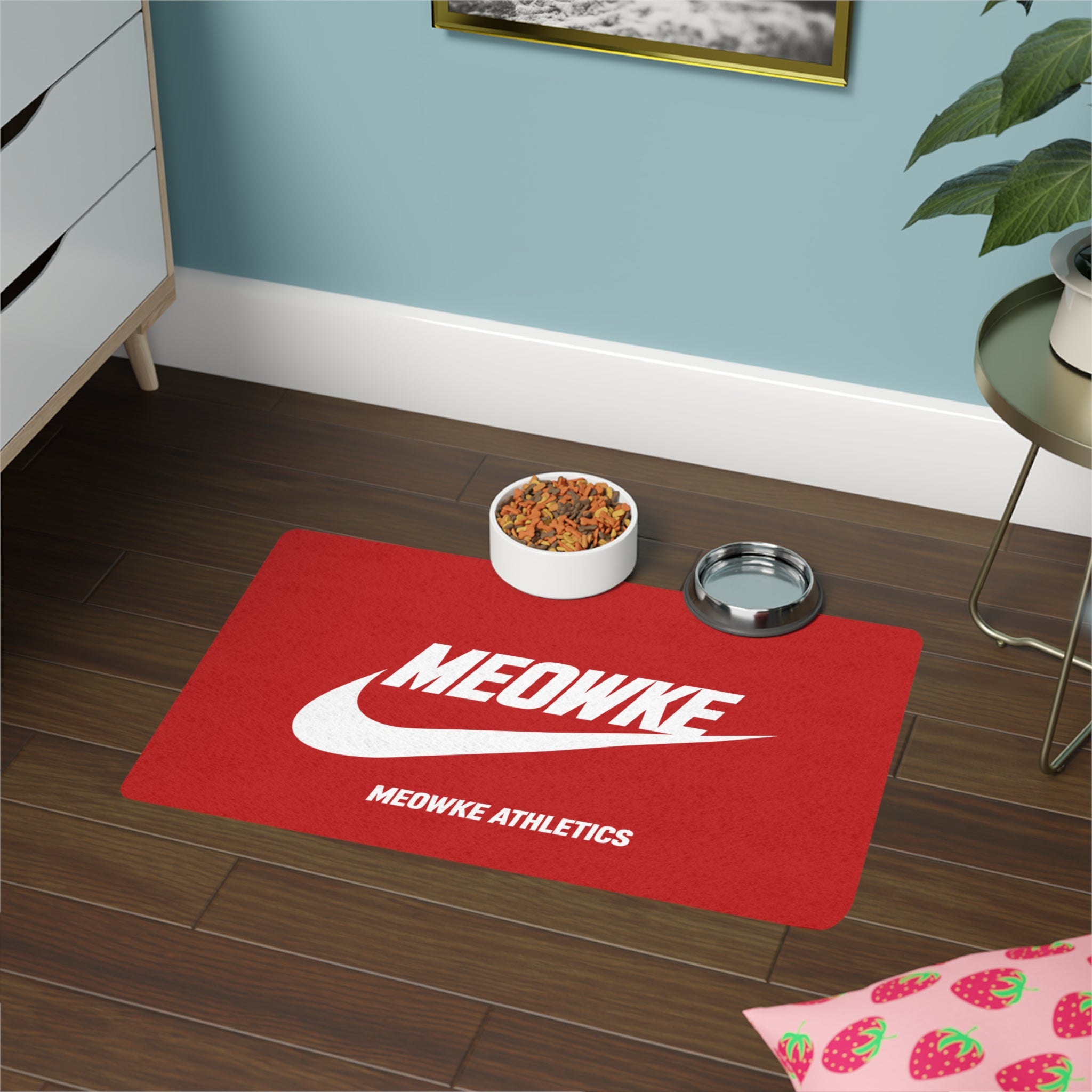 Meowke red cat food mat with food and water bowls on a clean athletic logo layout