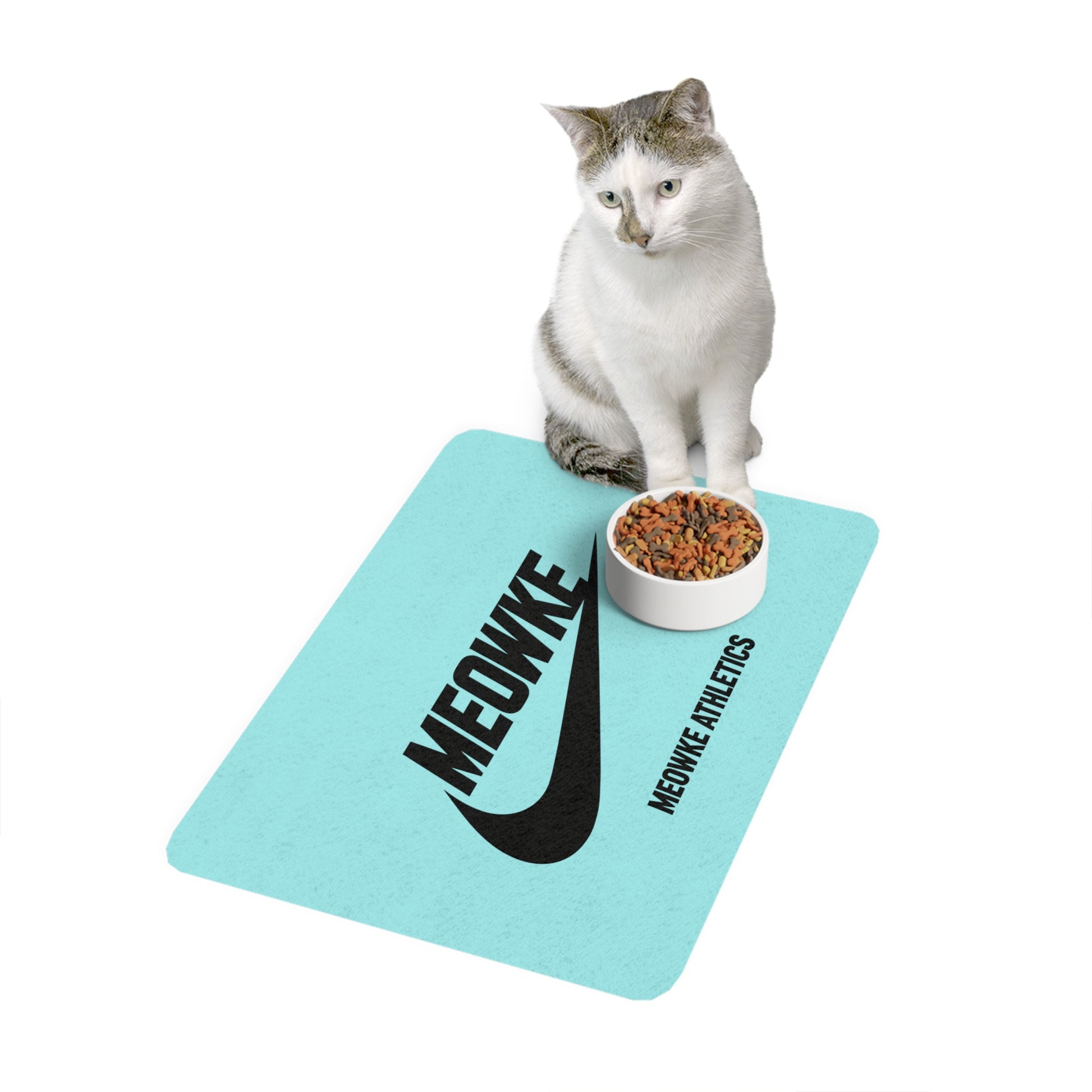 Meowke teal cat food mat with seated cat and bowl on a sport inspired logo design