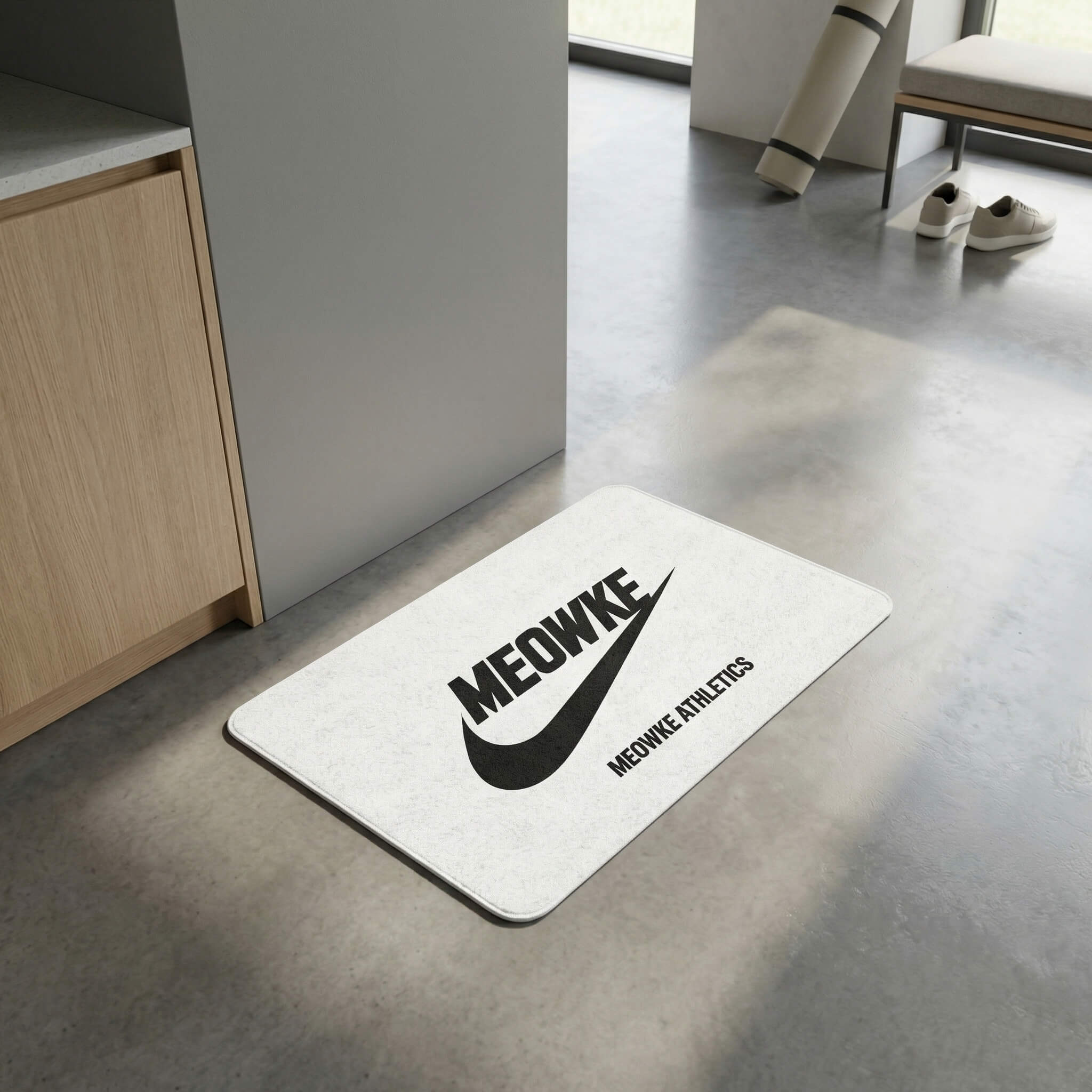 Meowke white cat food mat with athletic logo placed on a clean modern floor